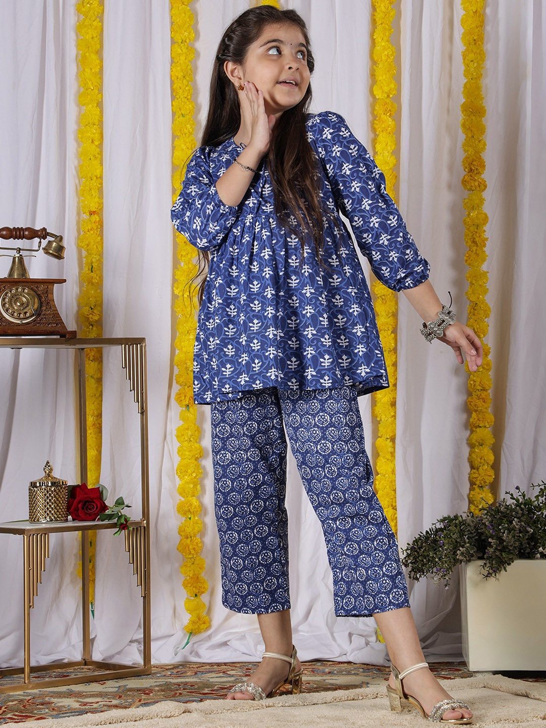 NEUDIS Girls Ethnic Motifs Printed Pleated Pure Cotton A Line Kurta with Trousers, Navy blue
NEUDIS Girls Ethnic Motifs Printed Pleated Pure Cotton A Line Kurta with Trousers, Navy blue