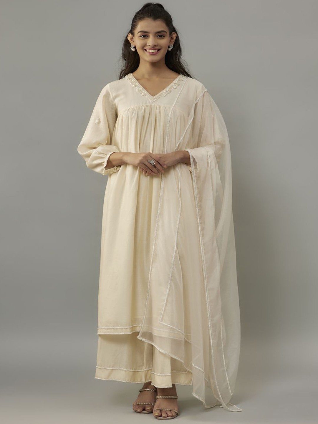 The Aarya Floral Embroidered Beads and Stones A-Line Kurta With Palazzos & Dupatta, Beige
The Aarya Floral Embroidered Beads and Stones A-Line Kurta With Palazzos & Dupatta, Beige