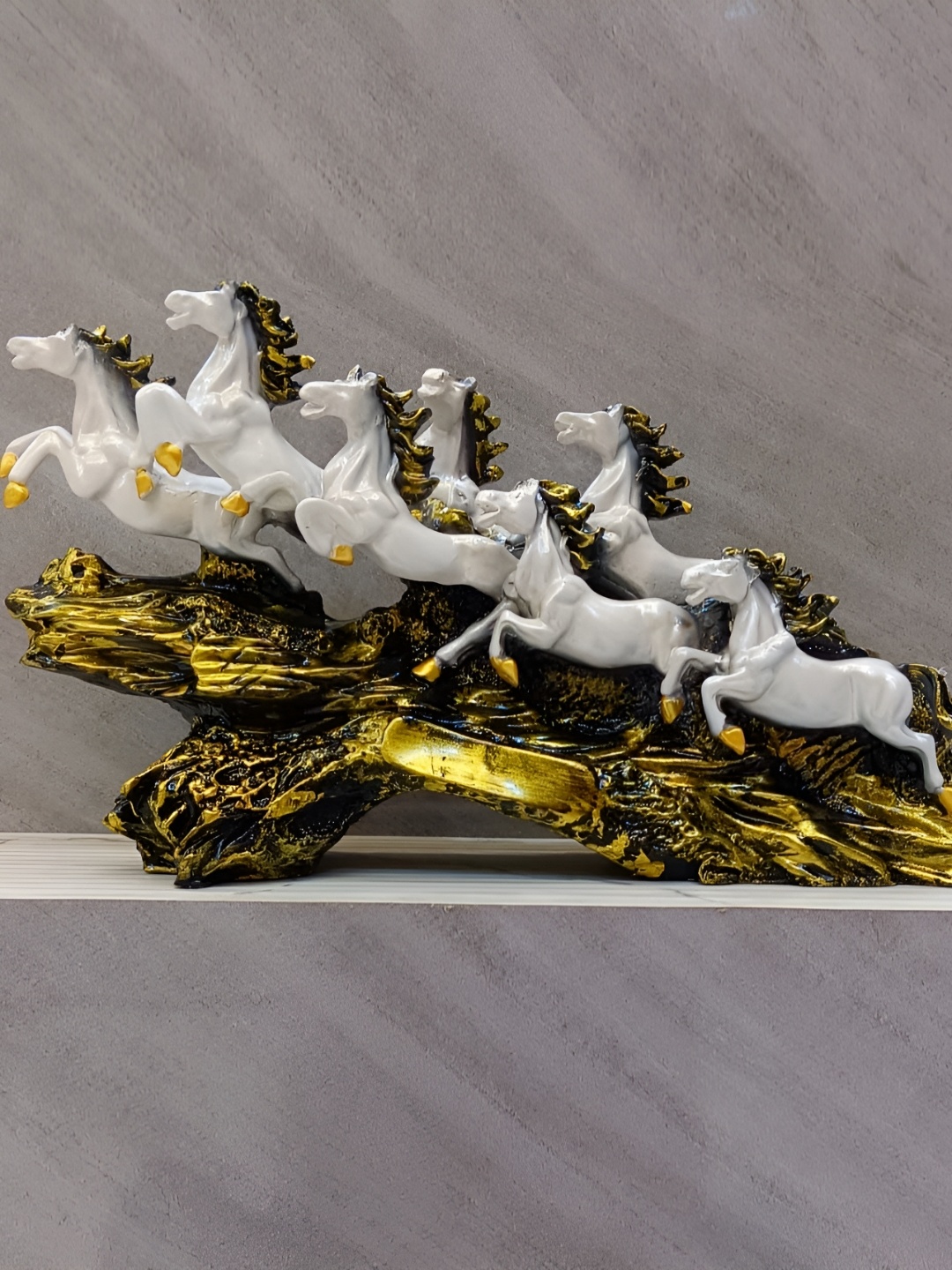 SANKALAN CREATIONS White & Gold Toned The 7 Running Majestic Horse Marble Showpiece
SANKALAN CREATIONS White & Gold Toned The 7 Running Majestic Horse Marble Showpiece