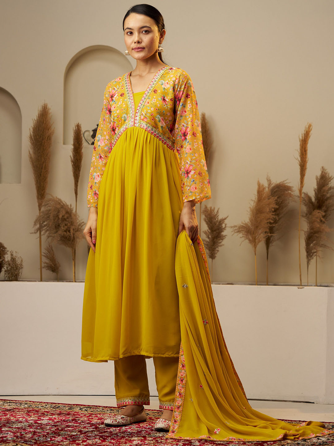 KALINI Floral Printed Empire Thread Work Anarakali Kurta With Trousers & Dupatta, Mustard
KALINI Floral Printed Empire Thread Work Anarakali Kurta With Trousers & Dupatta, Mustard