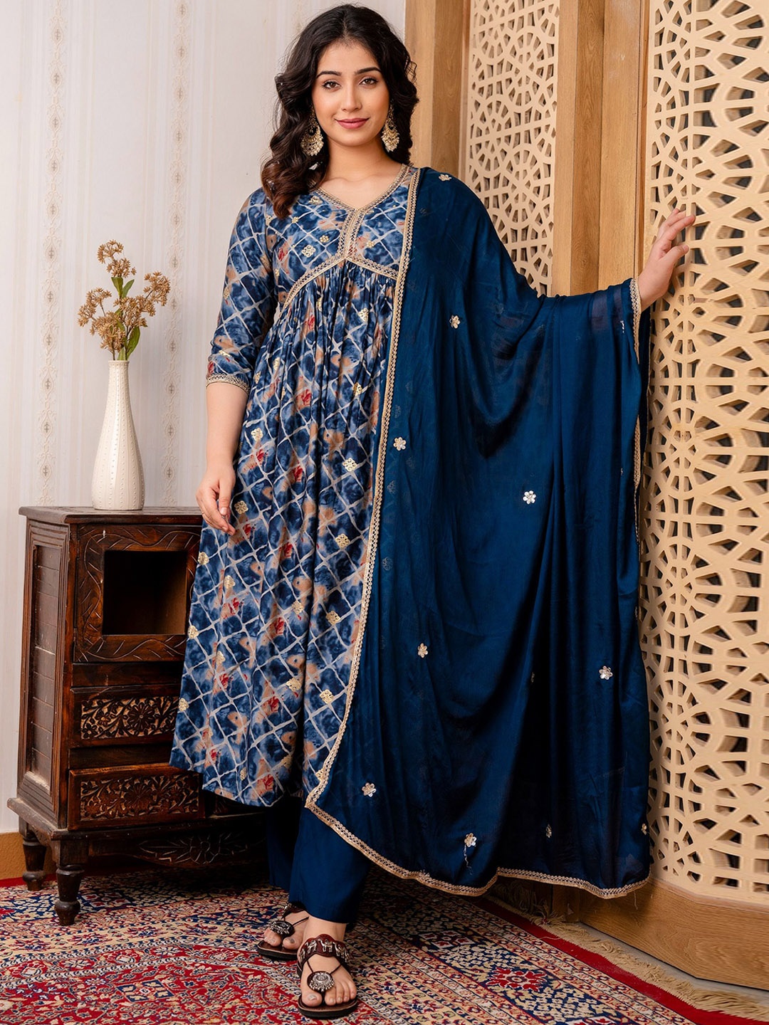 CELEBRAVO Women Floral Embroidered Pleated Gotta Patti Chanderi Silk Kurta with Trousers & With Dupatta, Blue
CELEBRAVO Women Floral Embroidered Pleated Gotta Patti Chanderi Silk Kurta with Trousers & With Dupatta, Blue