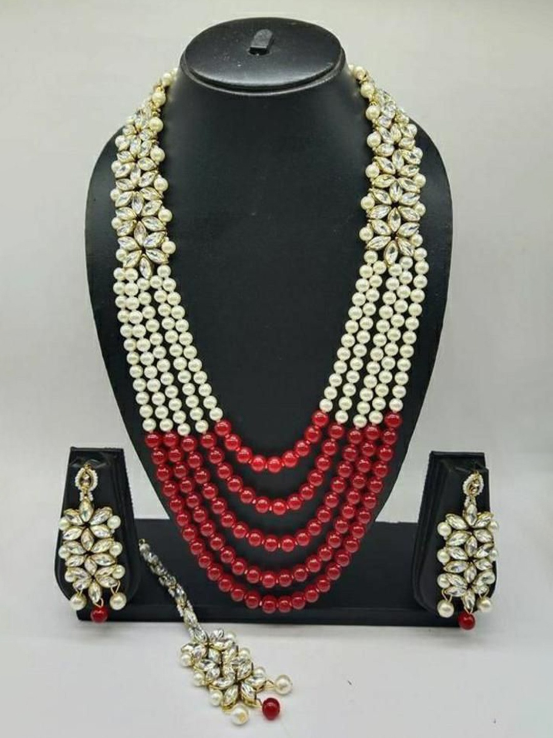 Gyaan Jewels Gold-Plated Stone-Studded & Beaded Necklace and Earrings With Maang Tika
Gyaan Jewels Gold-Plated Stone-Studded & Beaded Necklace and Earrings With Maang Tika
