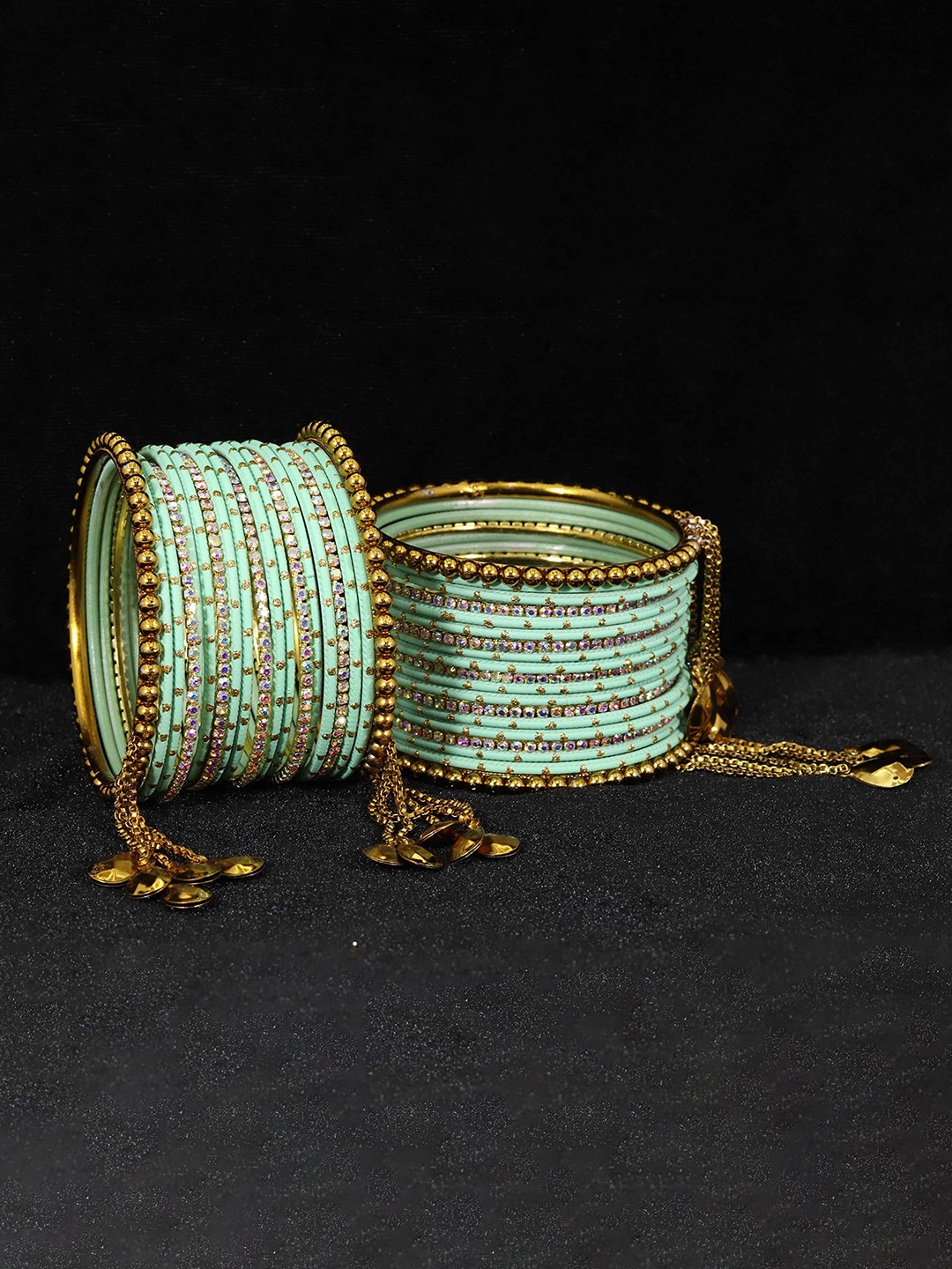 ZULKA Set of 38 Zari Dotted and Rainbow Zircon Gemstone Metal Bangles, Turquoise blue
ZULKA Set of 38 Zari Dotted and Rainbow Zircon Gemstone Metal Bangles, Turquoise blue