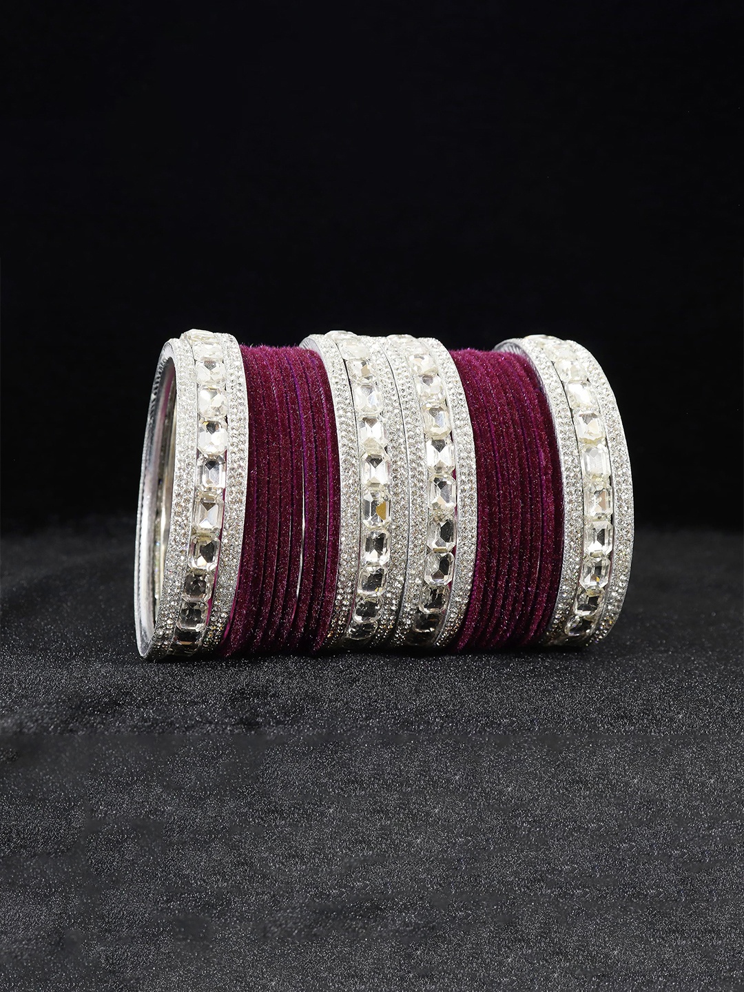 ZULKA Set Of 28 Silver Plated Metal Bangles Studded with Zircon Gemstone & Velvet Bangles
ZULKA Set Of 28 Silver Plated Metal Bangles Studded with Zircon Gemstone & Velvet Bangles
