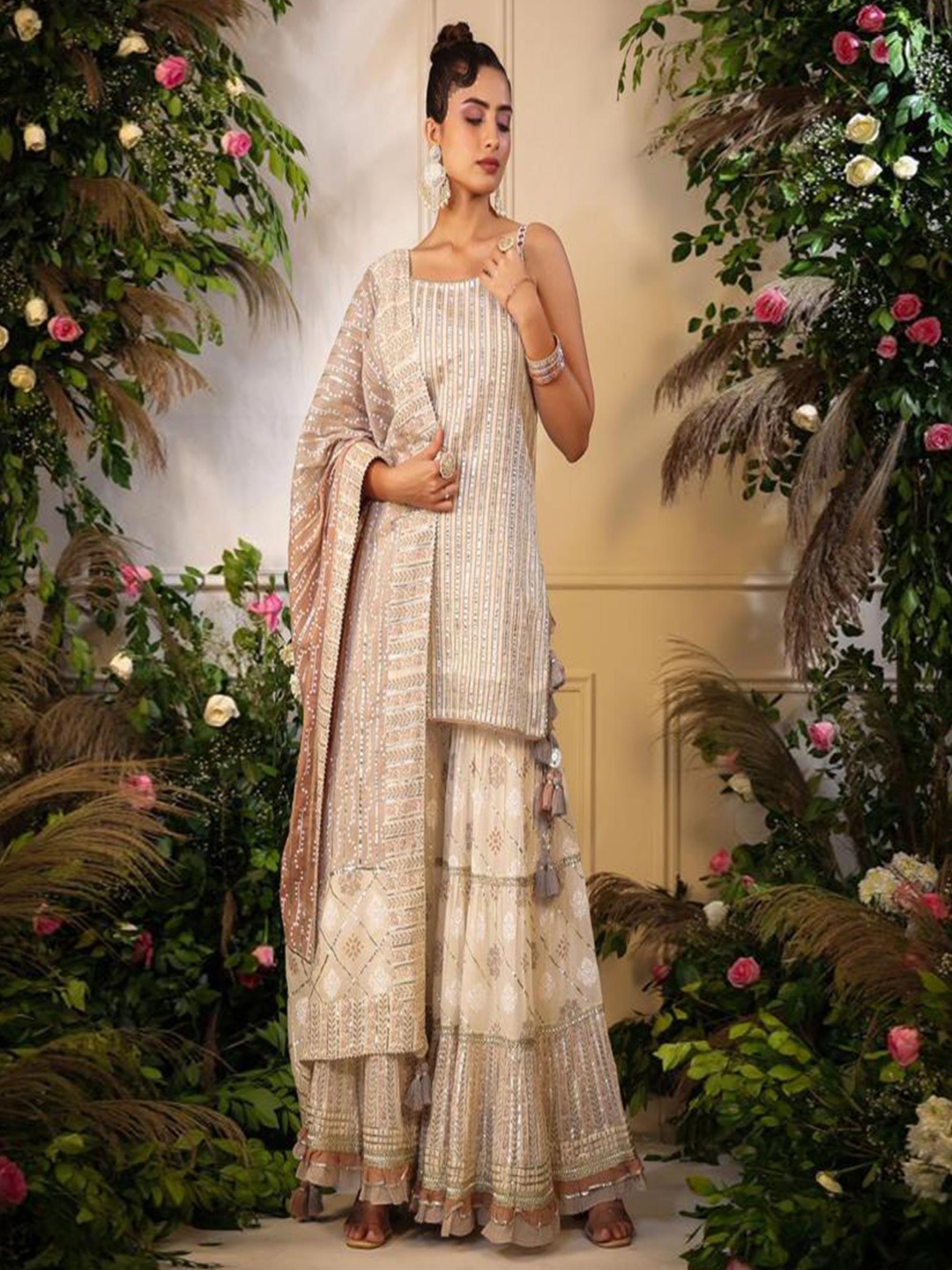 Peachmode Shoulder Straps Ethnic Printed Gotta Patti Cotton Kurti with Sharara & Dupatta, Cream
Peachmode Shoulder Straps Ethnic Printed Gotta Patti Cotton Kurti with Sharara & Dupatta, Cream
