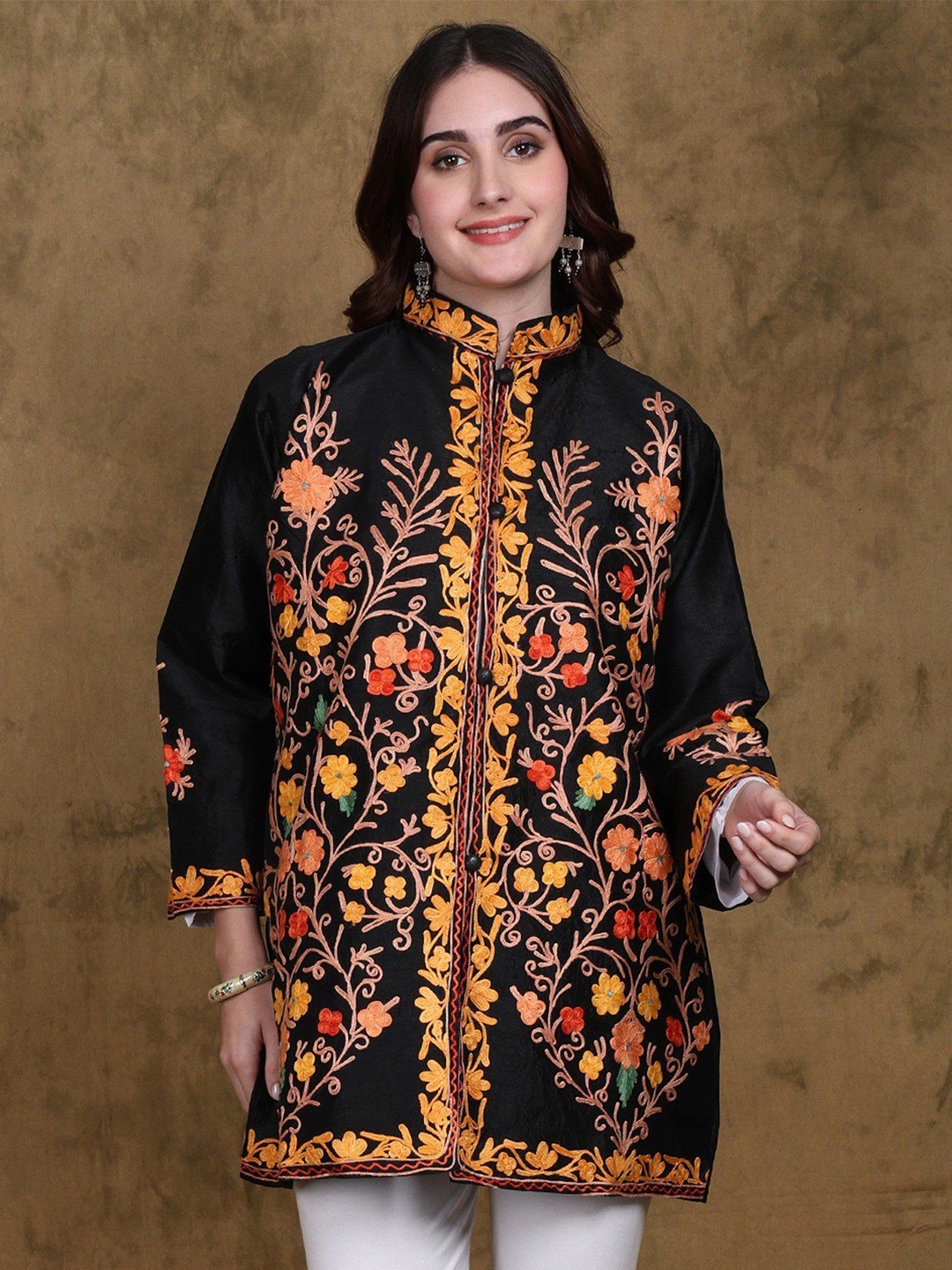 Exotic India Jet Black Art Silk Mandarin Collar Short Jacket with Aari Embroidered Flowers
Exotic India Jet Black Art Silk Mandarin Collar Short Jacket with Aari Embroidered Flowers