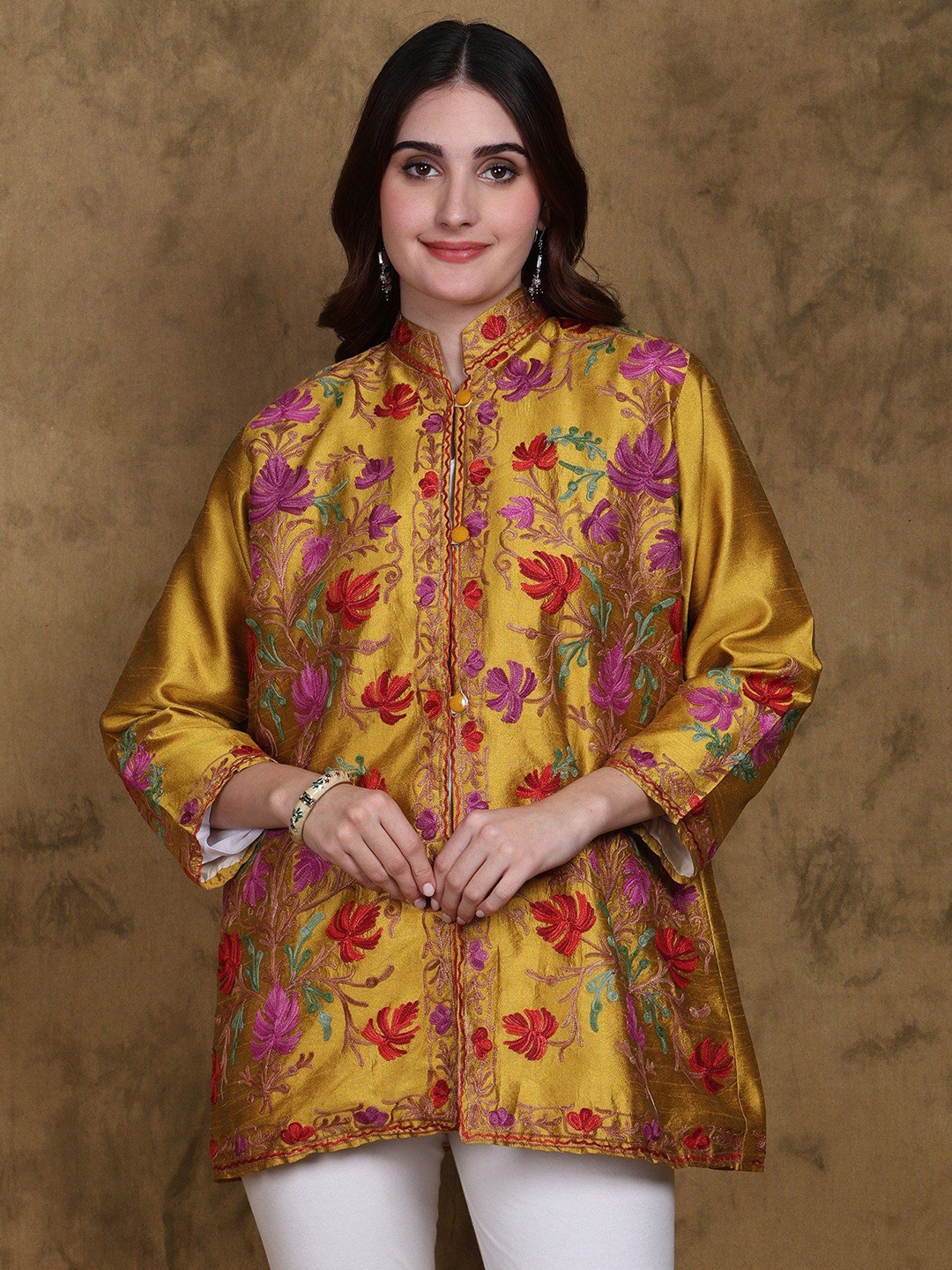 Exotic India Art Silk Mandarin Collar Kashmir Short Jacket with Floral Aari Embroidery, Mustard
Exotic India Art Silk Mandarin Collar Kashmir Short Jacket with Floral Aari Embroidery, Mustard