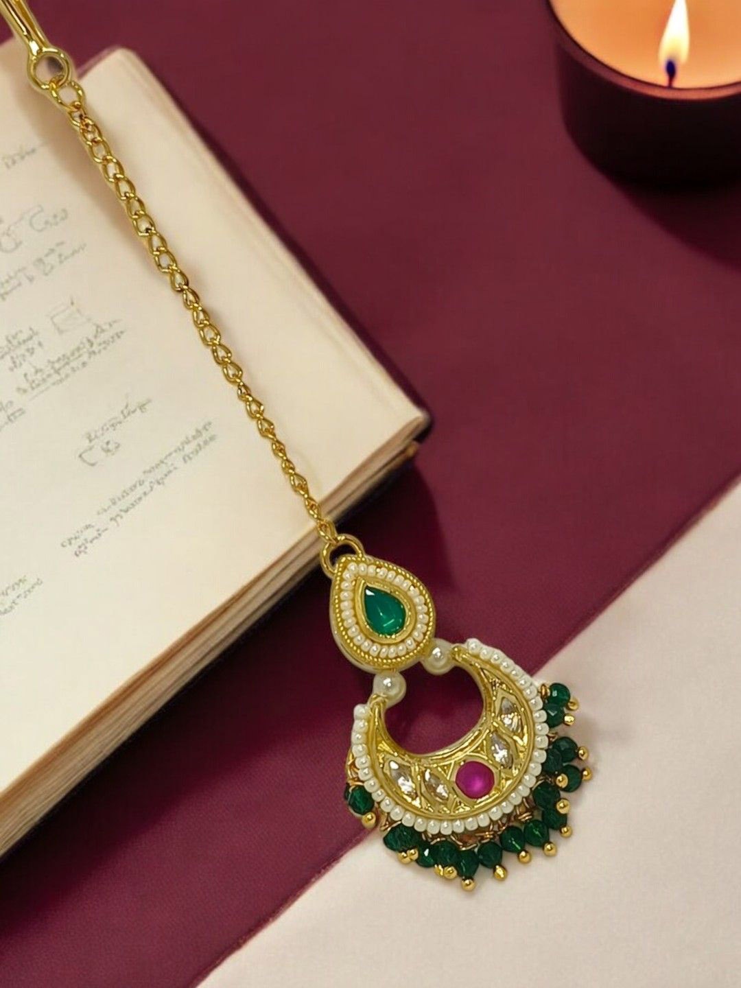 FEMMIBELLA Gold-Plated Artificial Stones and Beads Studded Maang Tikka Head Jewellery
FEMMIBELLA Gold-Plated Artificial Stones and Beads Studded Maang Tikka Head Jewellery