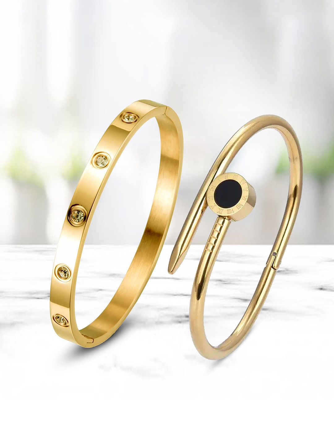 DIVASTRI Set Of 2 Stainless Steel Gold-Plated American Diamond Studded Kada Bracelets
DIVASTRI Set Of 2 Stainless Steel Gold-Plated American Diamond Studded Kada Bracelets