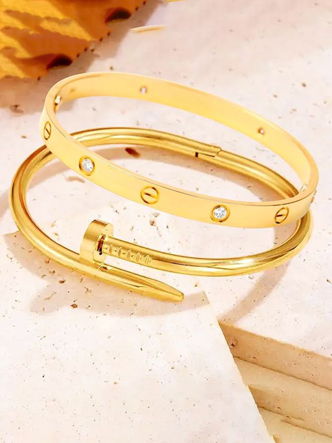DIVASTRI Set Of 2 Stainless Steel Gold-Plated American Diamond Studded Kada Bracelets
DIVASTRI Set Of 2 Stainless Steel Gold-Plated American Diamond Studded Kada Bracelets