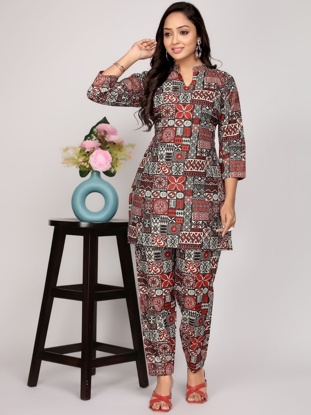 NIJANAND TEXTILE Mandarin Collar Floral Printed Pure Cotton Top With Trousers, Maroon
NIJANAND TEXTILE Mandarin Collar Floral Printed Pure Cotton Top With Trousers, Maroon