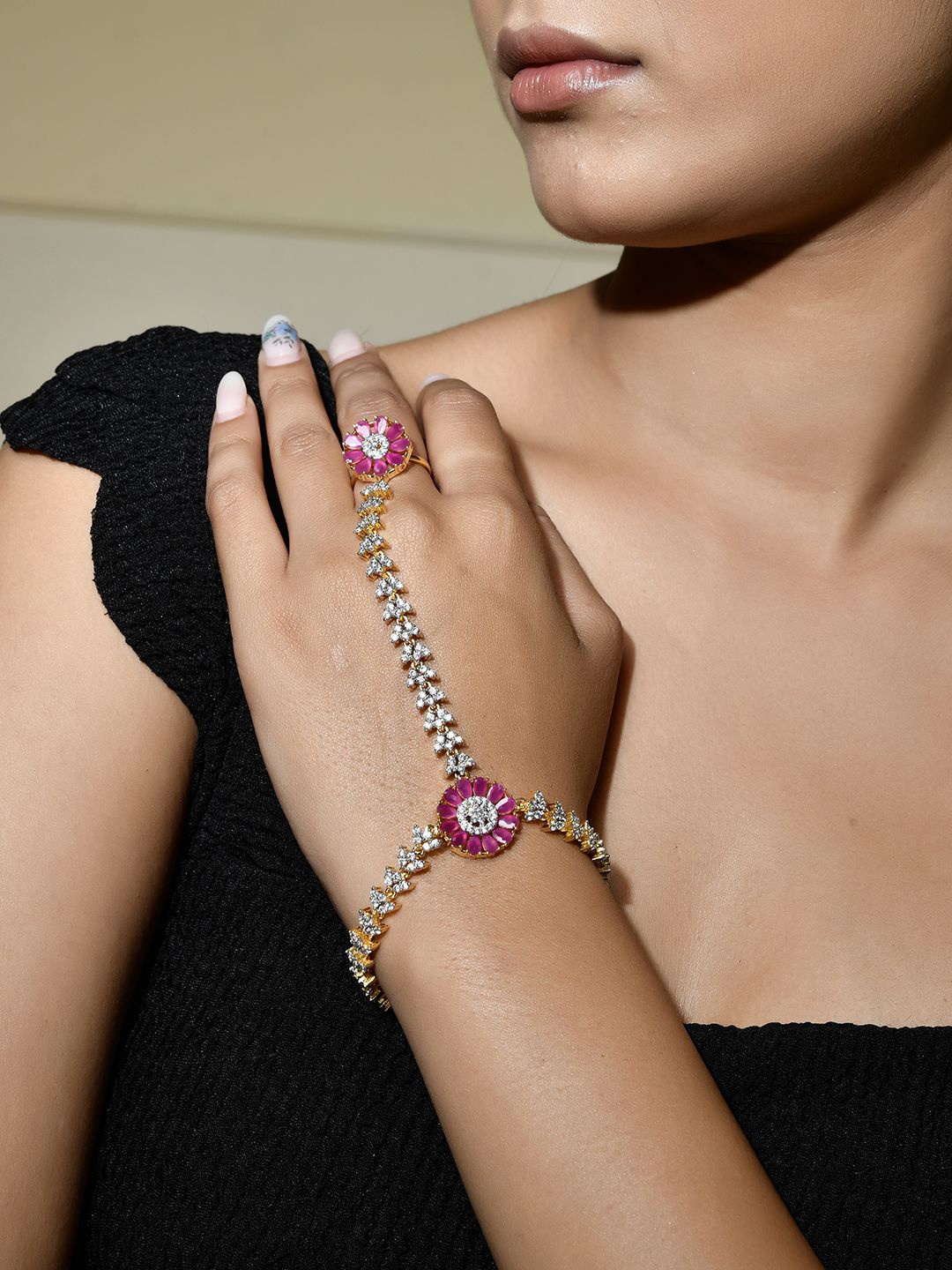 Voylla Gold-Plated Sparkling Elegance Radiant Blooms AD Studded Hath Phool Ring Bracelet
Voylla Gold-Plated Sparkling Elegance Radiant Blooms AD Studded Hath Phool Ring Bracelet