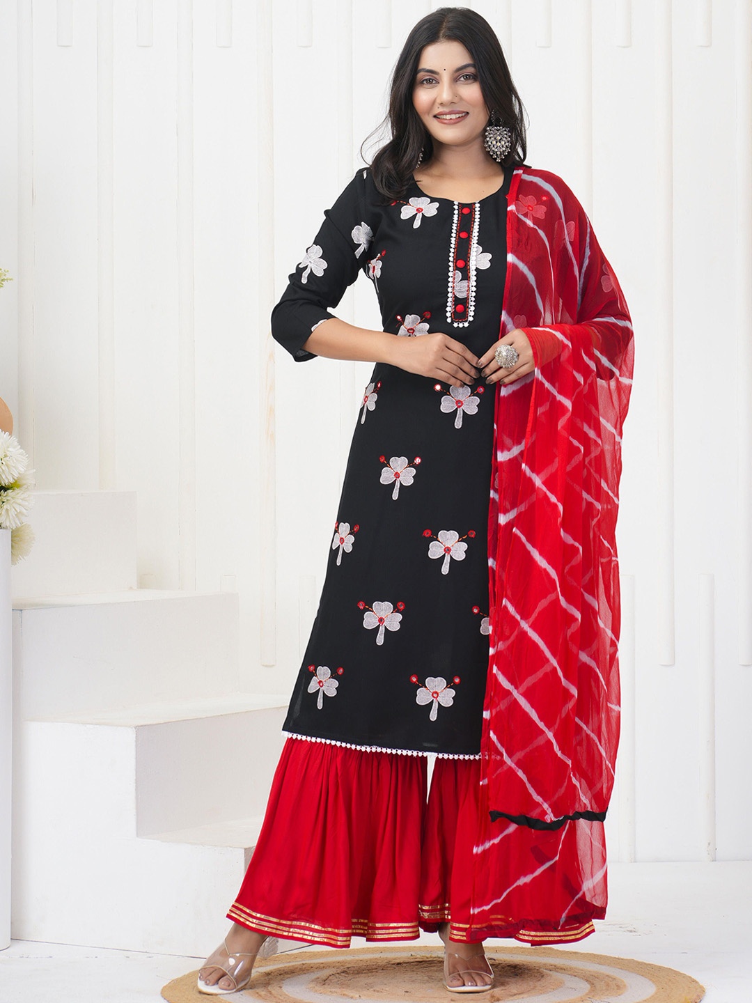 KALINI Floral Printed Regular Gotta Patti Straight Kurta with Sharara & Dupatta, Black
KALINI Floral Printed Regular Gotta Patti Straight Kurta with Sharara & Dupatta, Black