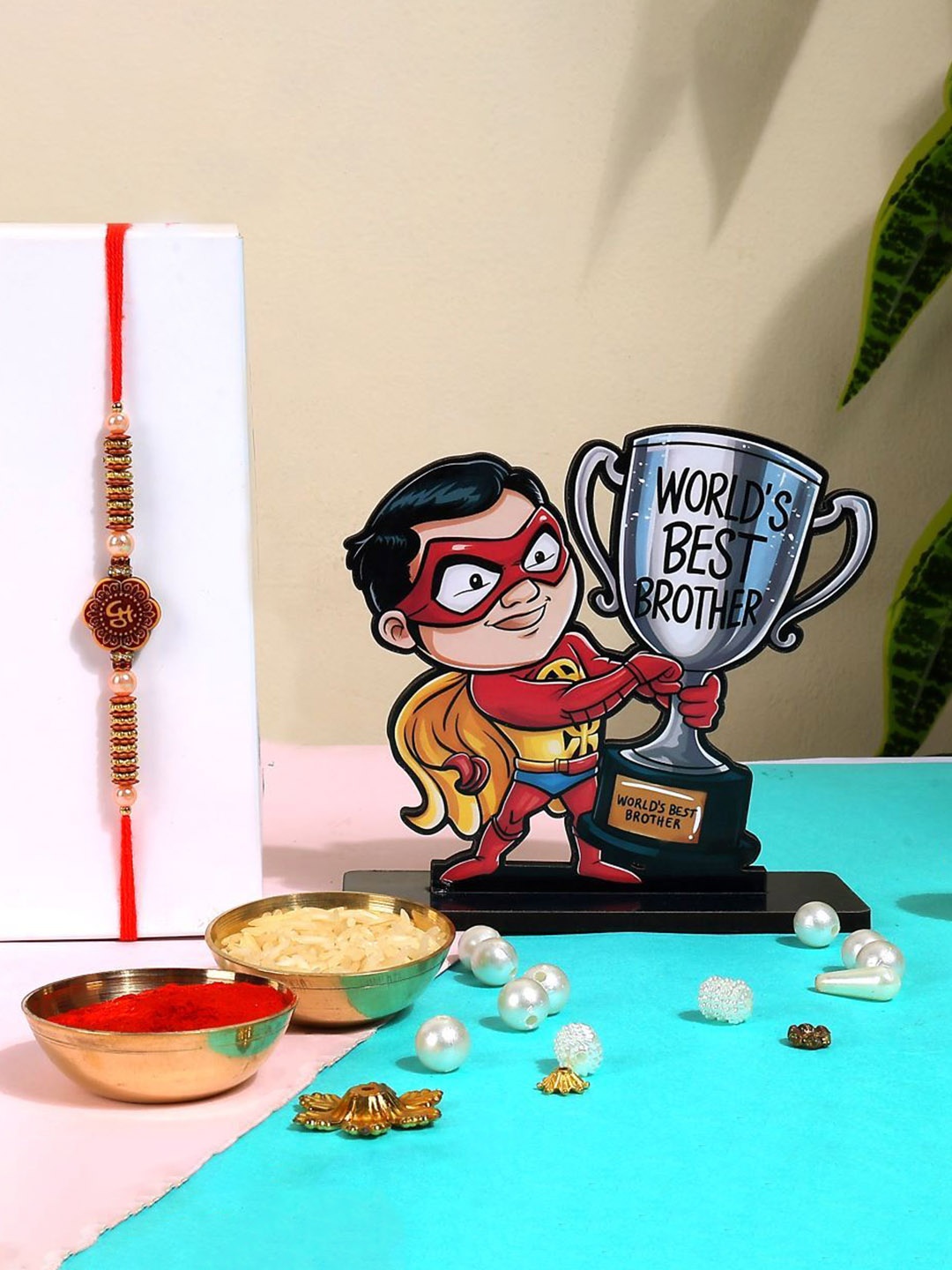 Phirki Studio Set of 2 Beaded Thread Rakhi With Brosis Table Stand & Roli Chawal, Gold
Phirki Studio Set of 2 Beaded Thread Rakhi With Brosis Table Stand & Roli Chawal, Gold