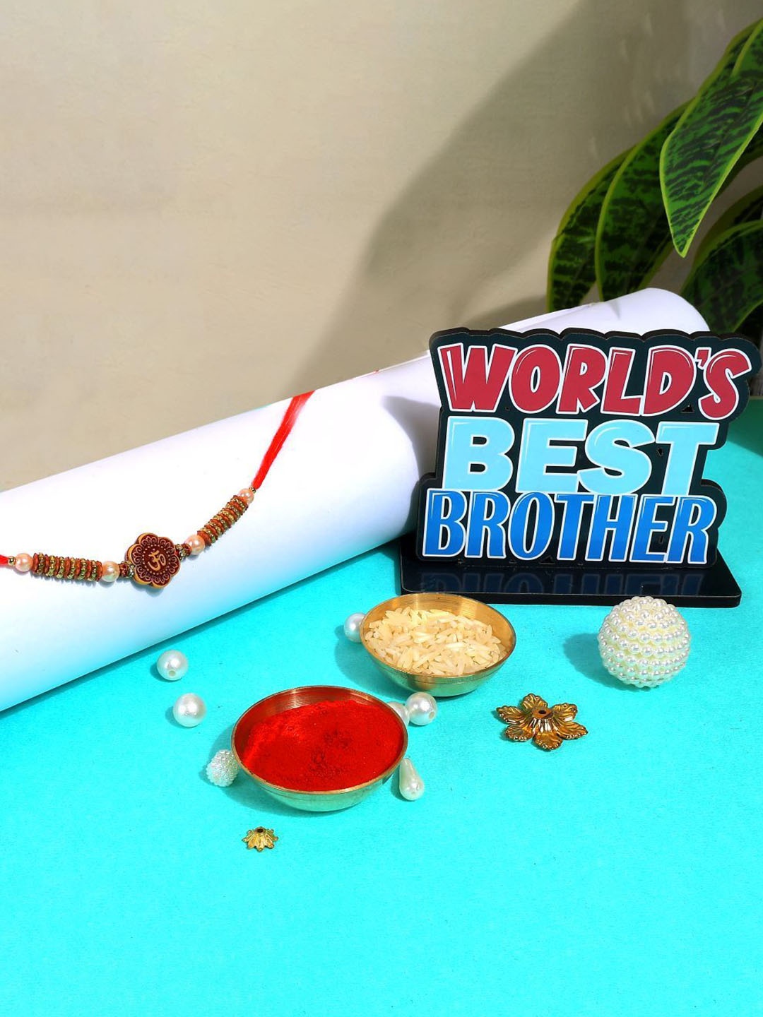 Phirki Studio Set of 2 Beaded Thread Rakhi With Brosis Table Stand & Roli Chawal, Gold
Phirki Studio Set of 2 Beaded Thread Rakhi With Brosis Table Stand & Roli Chawal, Gold