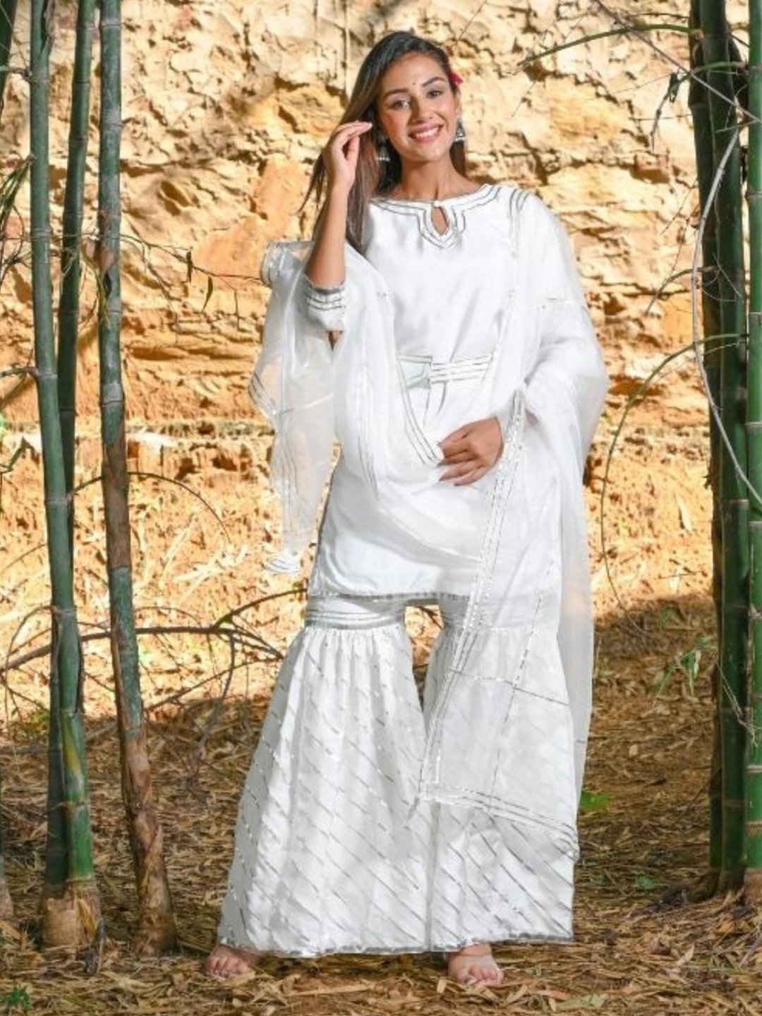 HOUSE OF JAMOTI Keyhole Neck Gotta Patti Pure Cotton Straight Kurta with Sharara & Dupatta, White
HOUSE OF JAMOTI Keyhole Neck Gotta Patti Pure Cotton Straight Kurta with Sharara & Dupatta, White