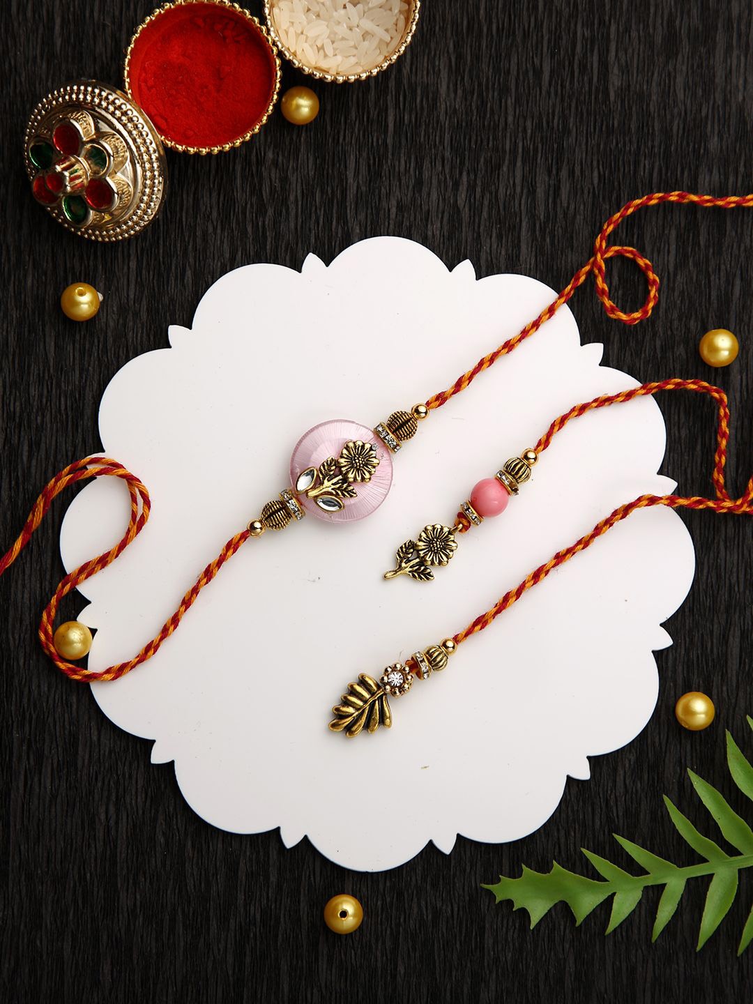 Anouk Pink Stone Studded & Beaded Floral Bhaiya Bhabhi Thread Rakhis With Roli Chawal, Gold
Anouk Pink Stone Studded & Beaded Floral Bhaiya Bhabhi Thread Rakhis With Roli Chawal, Gold
