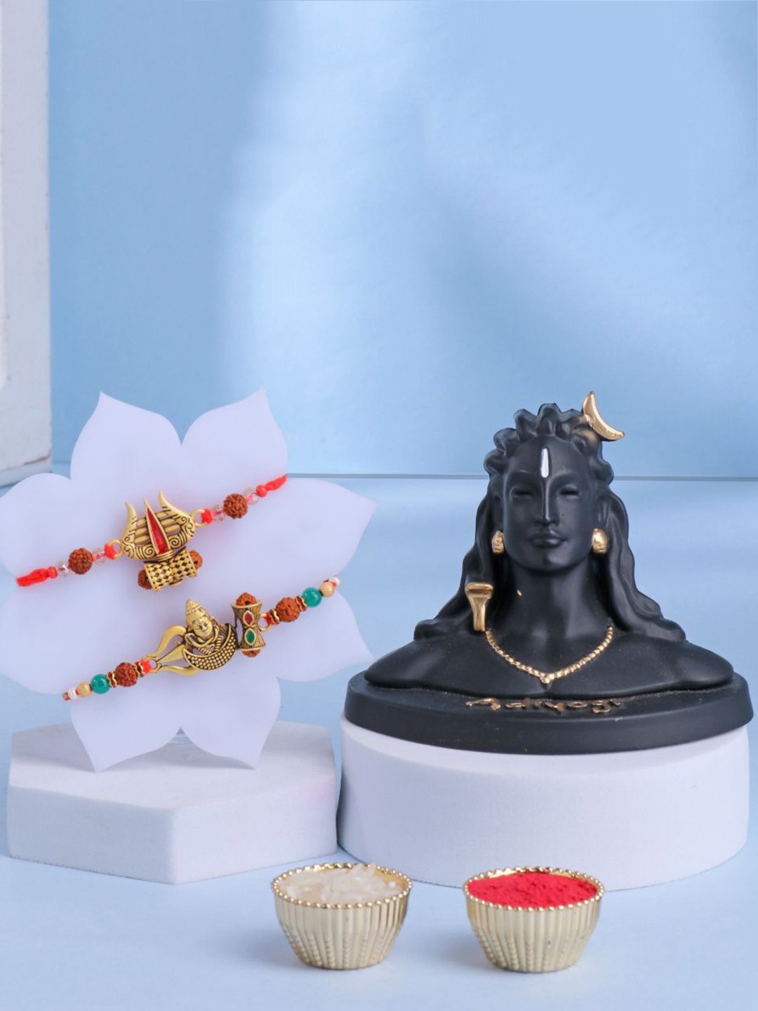Floweraura Set Of 3 Damru Rakhis With Lord Shiva Adiyogi Idol Showpiece & Roli Chawal, Gold
Floweraura Set Of 3 Damru Rakhis With Lord Shiva Adiyogi Idol Showpiece & Roli Chawal, Gold