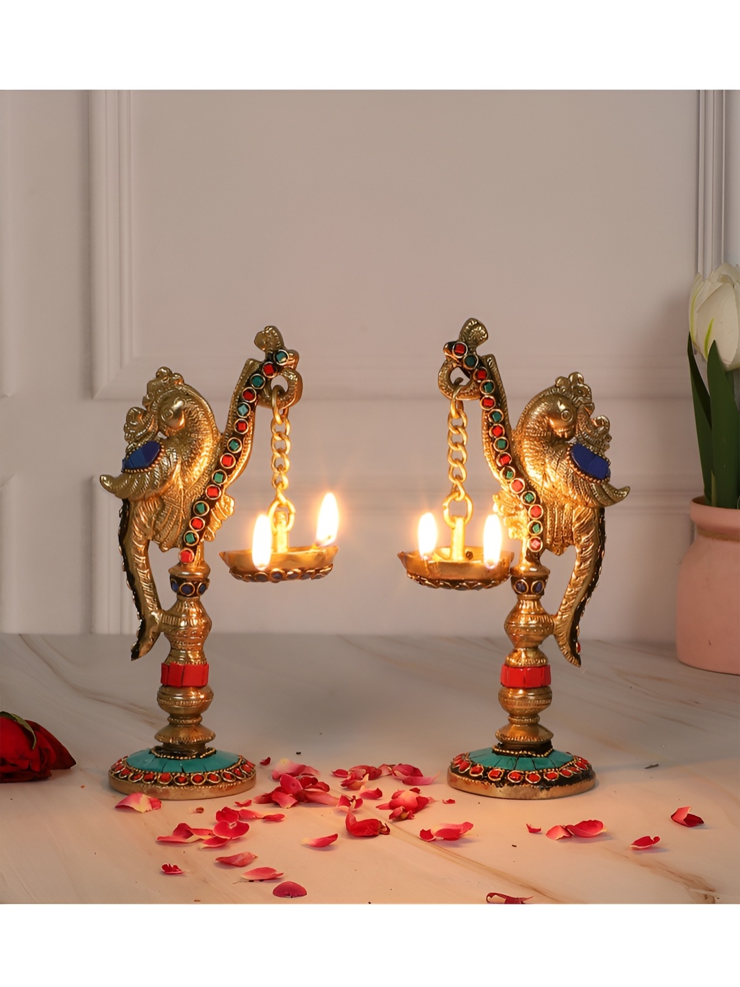 Two Moustaches Gold Toned 2 Pieces Gemstone Work Peacock On Pillar Design Brass Diyas
Two Moustaches Gold Toned 2 Pieces Gemstone Work Peacock On Pillar Design Brass Diyas