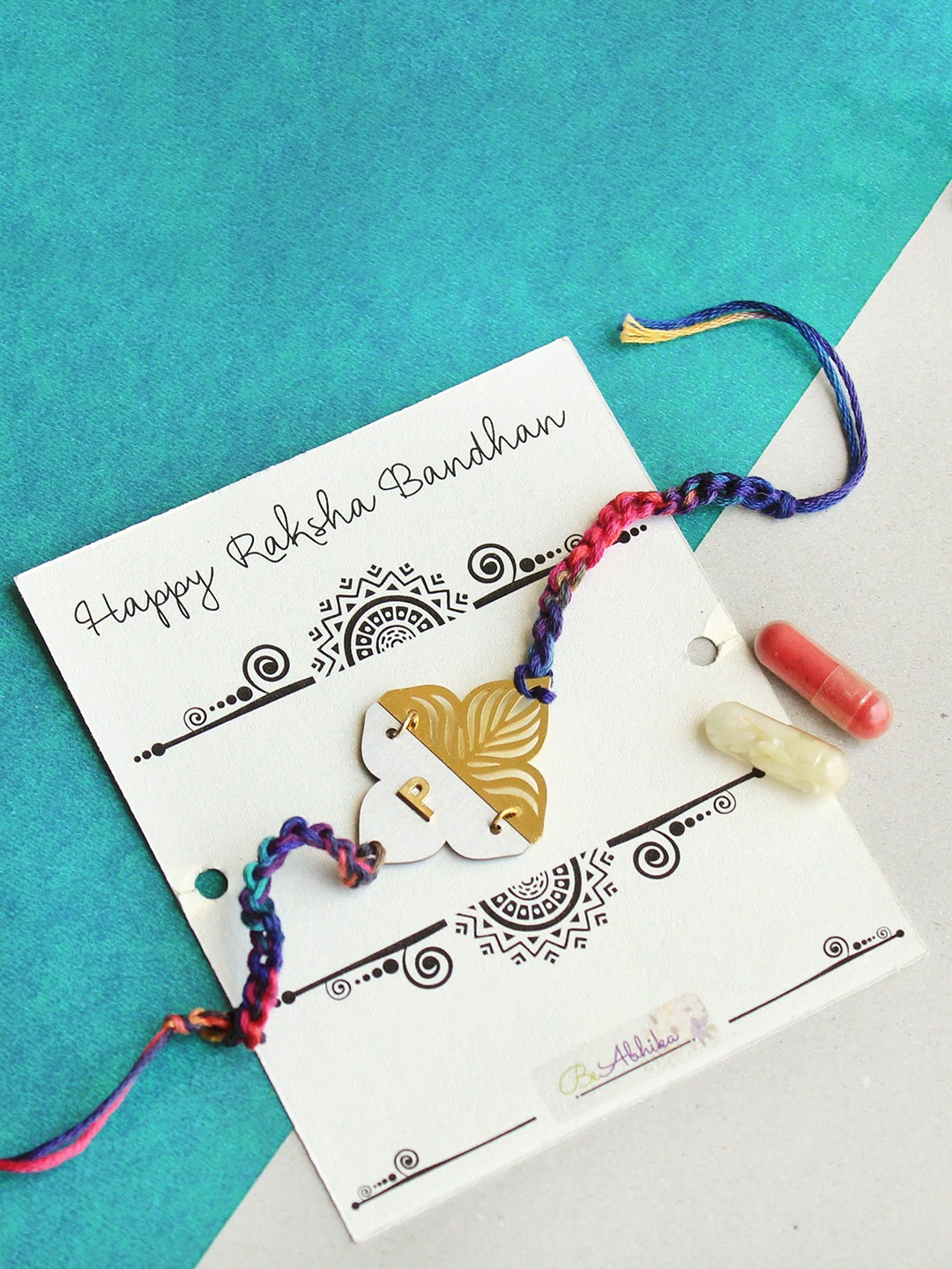 BeAbhika "L" Intial Personalised Floral Plate Thread Rakhi with Roli Chawal Capsules, Gold
BeAbhika "L" Intial Personalised Floral Plate Thread Rakhi with Roli Chawal Capsules, Gold