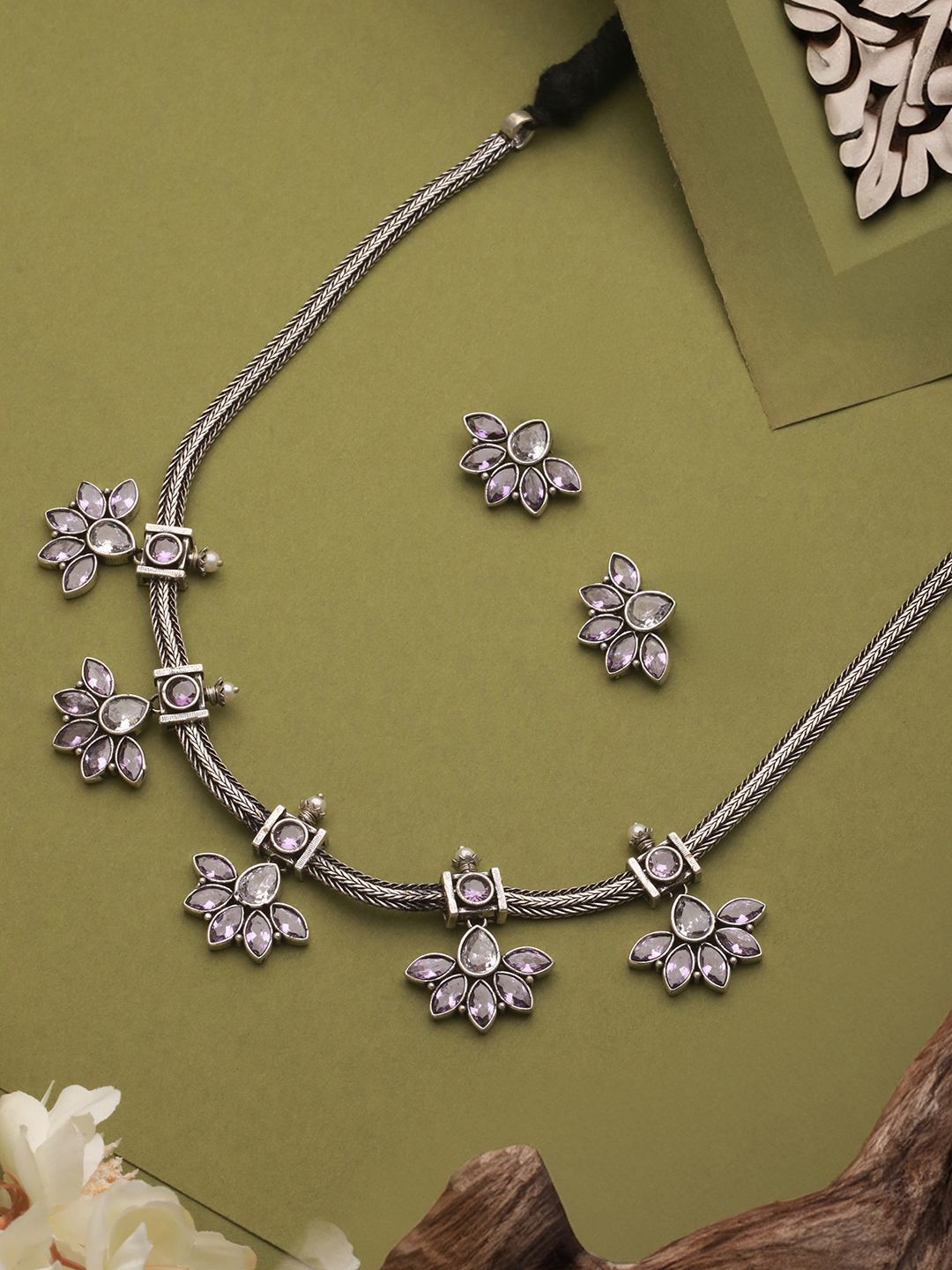 Saraf RS Jewellery Silver Plated Oxidised AD-Stone Studded Flower Motif Jewellery Set
Saraf RS Jewellery Silver Plated Oxidised AD-Stone Studded Flower Motif Jewellery Set