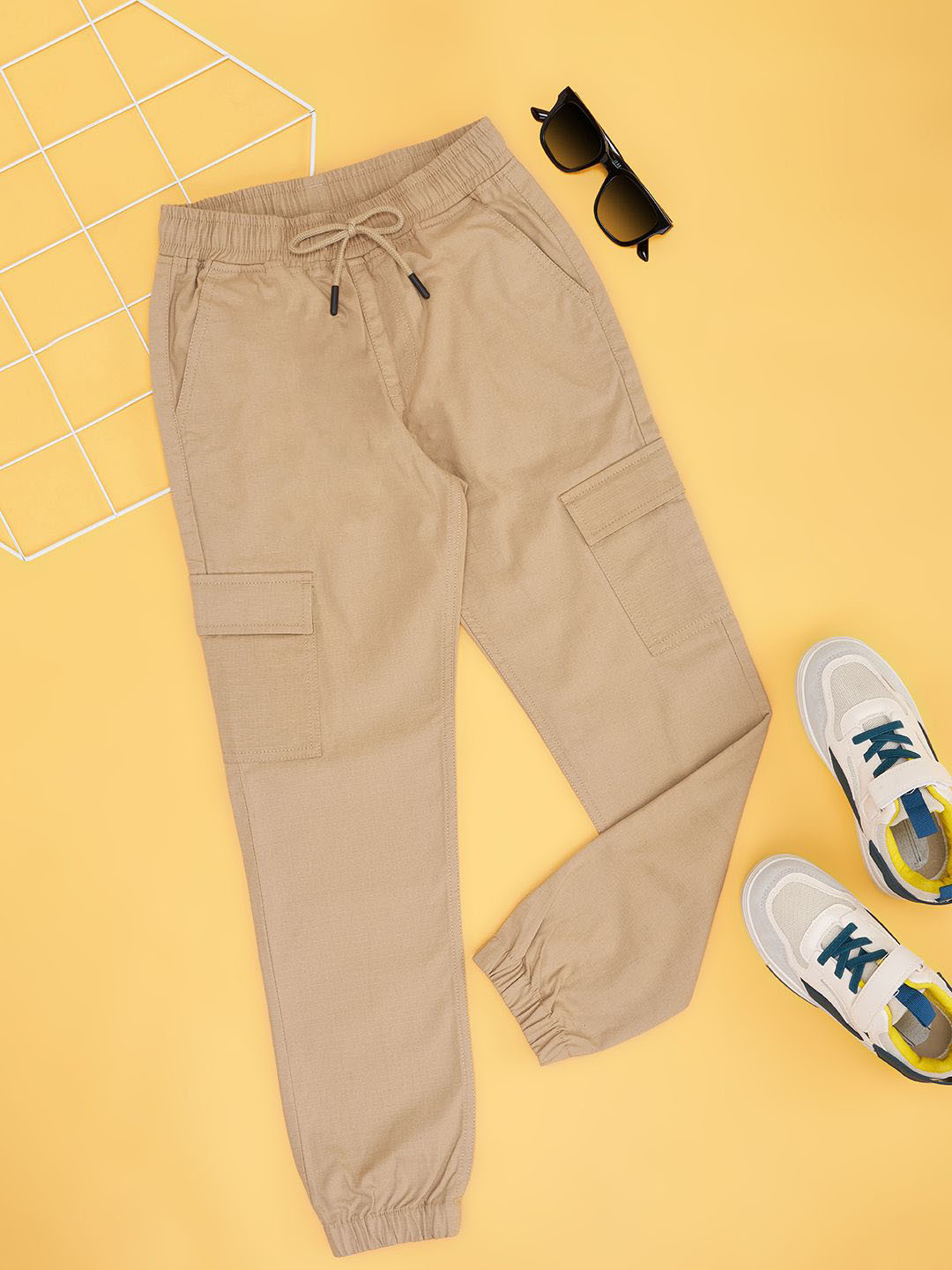 Pantaloons Junior Boys Cotton Mid-Rise Relaxed-Fit Track Pants, Beige 
Pantaloons Junior Boys Cotton Mid-Rise Relaxed-Fit Track Pants, Beige
