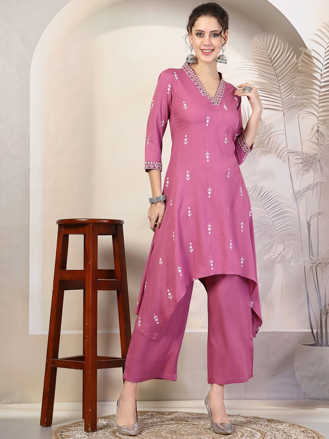 KIMAYRA V-Neck Ethnic Motifs Woven Design Thread Work Asymmetric A-Line Kurta with Palazzo, Purple
KIMAYRA V-Neck Ethnic Motifs Woven Design Thread Work Asymmetric A-Line Kurta with Palazzo, Purple