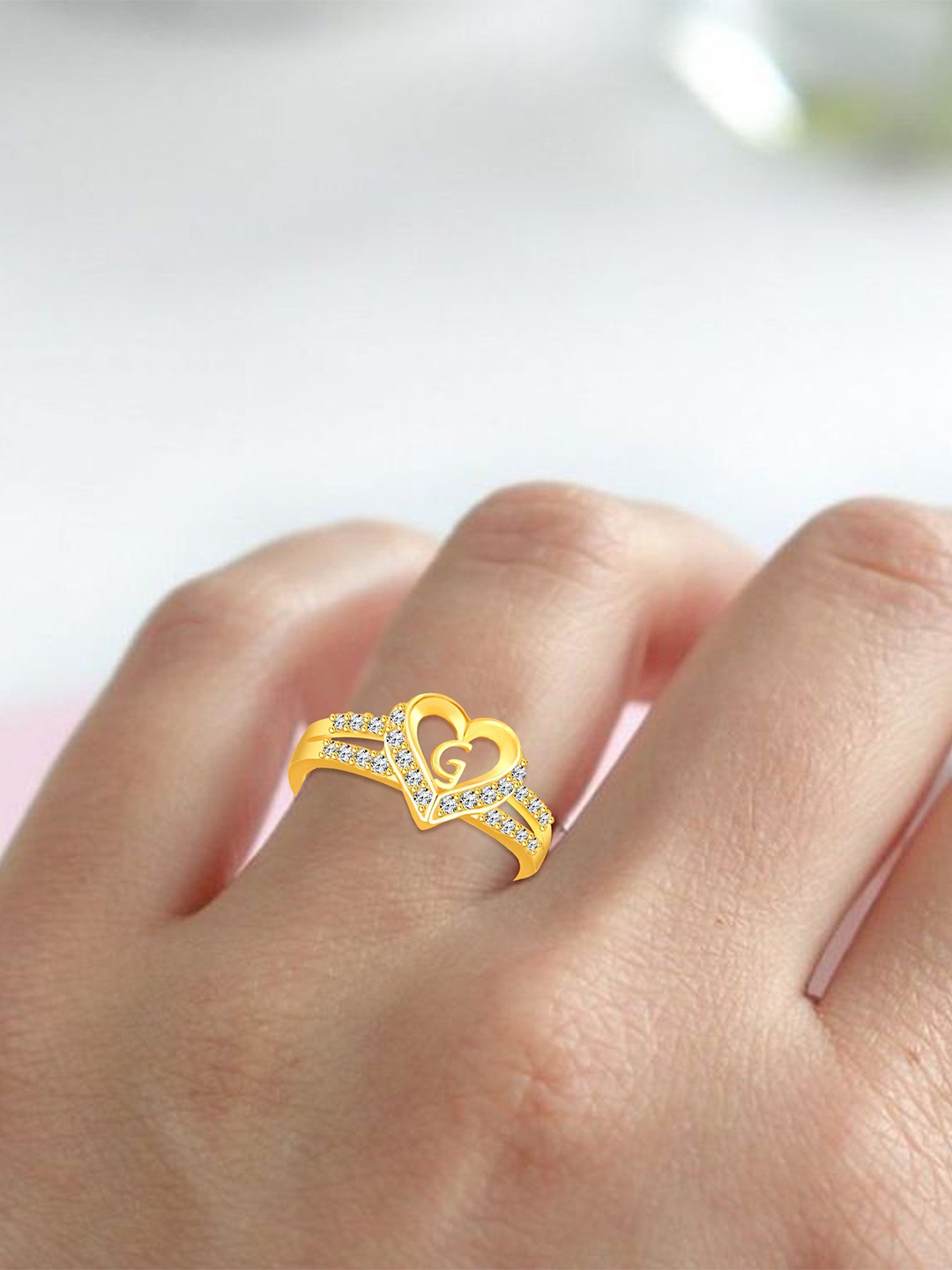 Lila Unisex Gold-Plated Cubic Zirconia Stone Studded Alphabet G Adjustable Finger Ring
Lila Unisex Gold-Plated Cubic Zirconia Stone Studded Alphabet G Adjustable Finger Ring