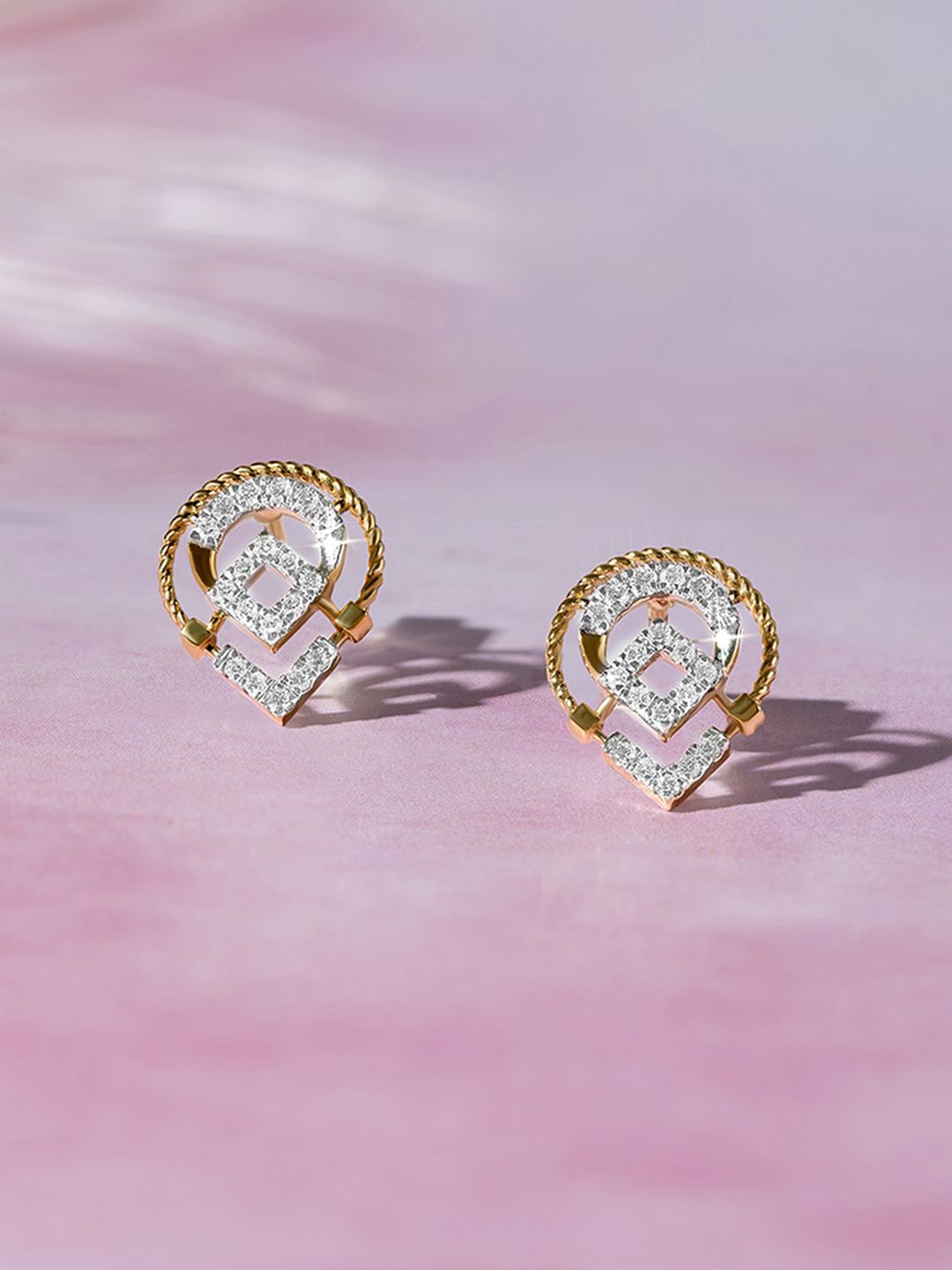 Mia by Tanishq Women 14KT Twisted Eleganc 1.82 Gold & Diamond Stud Earrings - 1.823 gm, Yellow
Mia by Tanishq Women 14KT Twisted Eleganc 1.82 Gold & Diamond Stud Earrings - 1.823 gm, Yellow