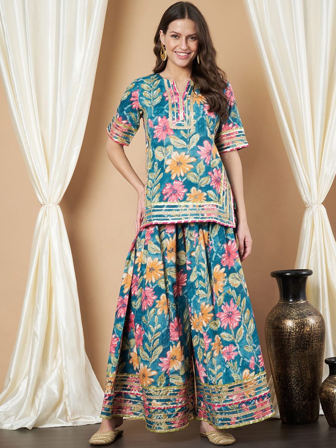 KALINI Women Floral Printed Regular Gotta Patti Pure Cotton Kurti with Palazzos, Teal
KALINI Women Floral Printed Regular Gotta Patti Pure Cotton Kurti with Palazzos, Teal