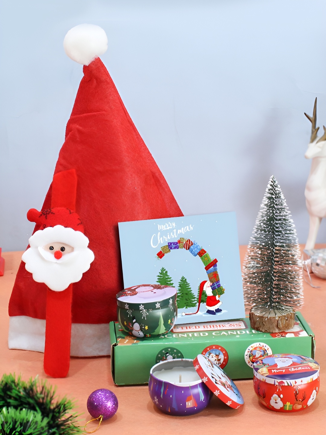 TIED RIBBONS Set of 6 Christmas Chocolate with 3 Pc Candles, Mini Tree & Cap Wrist Band, Red
TIED RIBBONS Set of 6 Christmas Chocolate with 3 Pc Candles, Mini Tree & Cap Wrist Band, Red