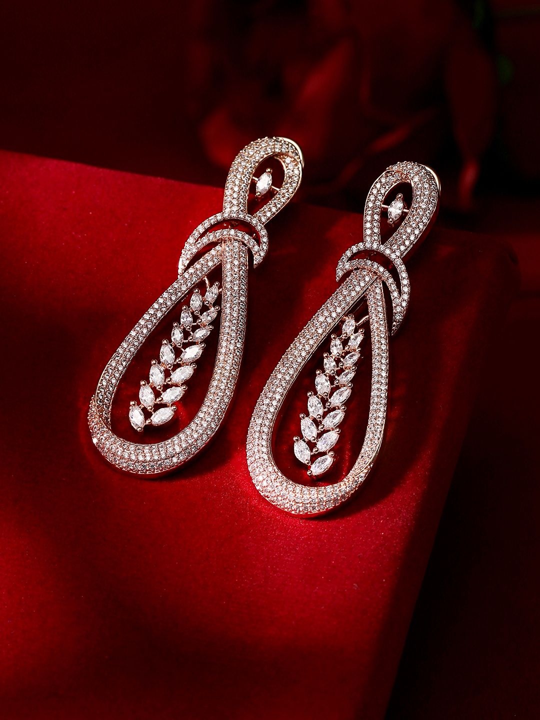 Priyaasi Rose Gold-Plated American Diamond Stone Studded Teardrop Shaped Drop Earrings
Priyaasi Rose Gold-Plated American Diamond Stone Studded Teardrop Shaped Drop Earrings