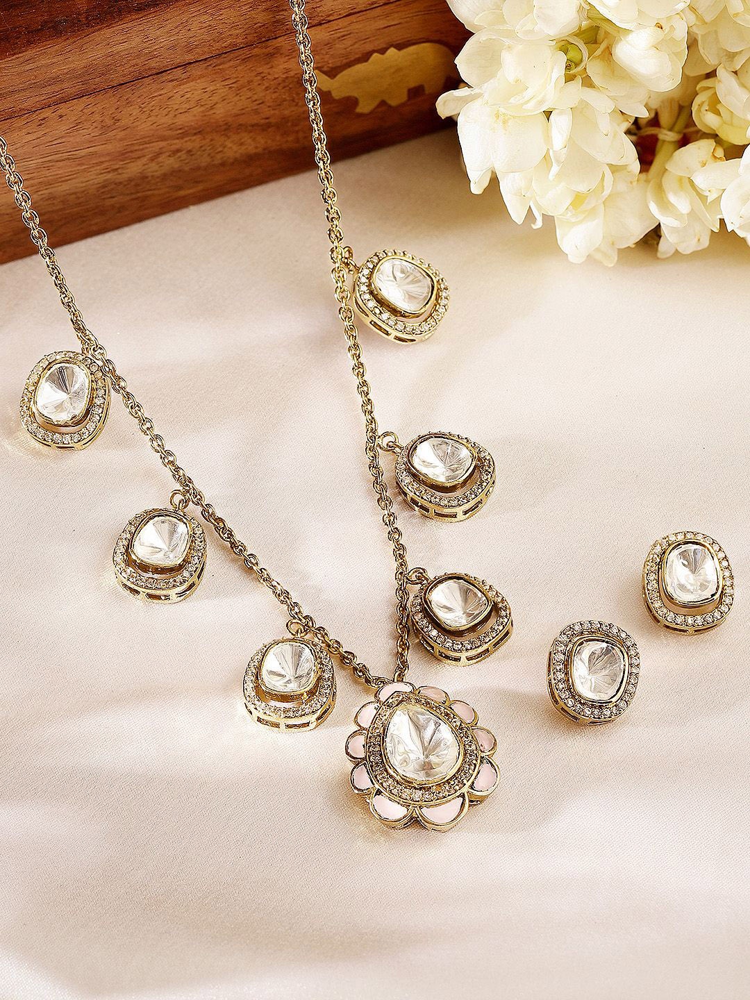 Priyaasi Gold Plated American Diamond-Studded Geometric Elegance Polki Jewellery Set
Priyaasi Gold Plated American Diamond-Studded Geometric Elegance Polki Jewellery Set