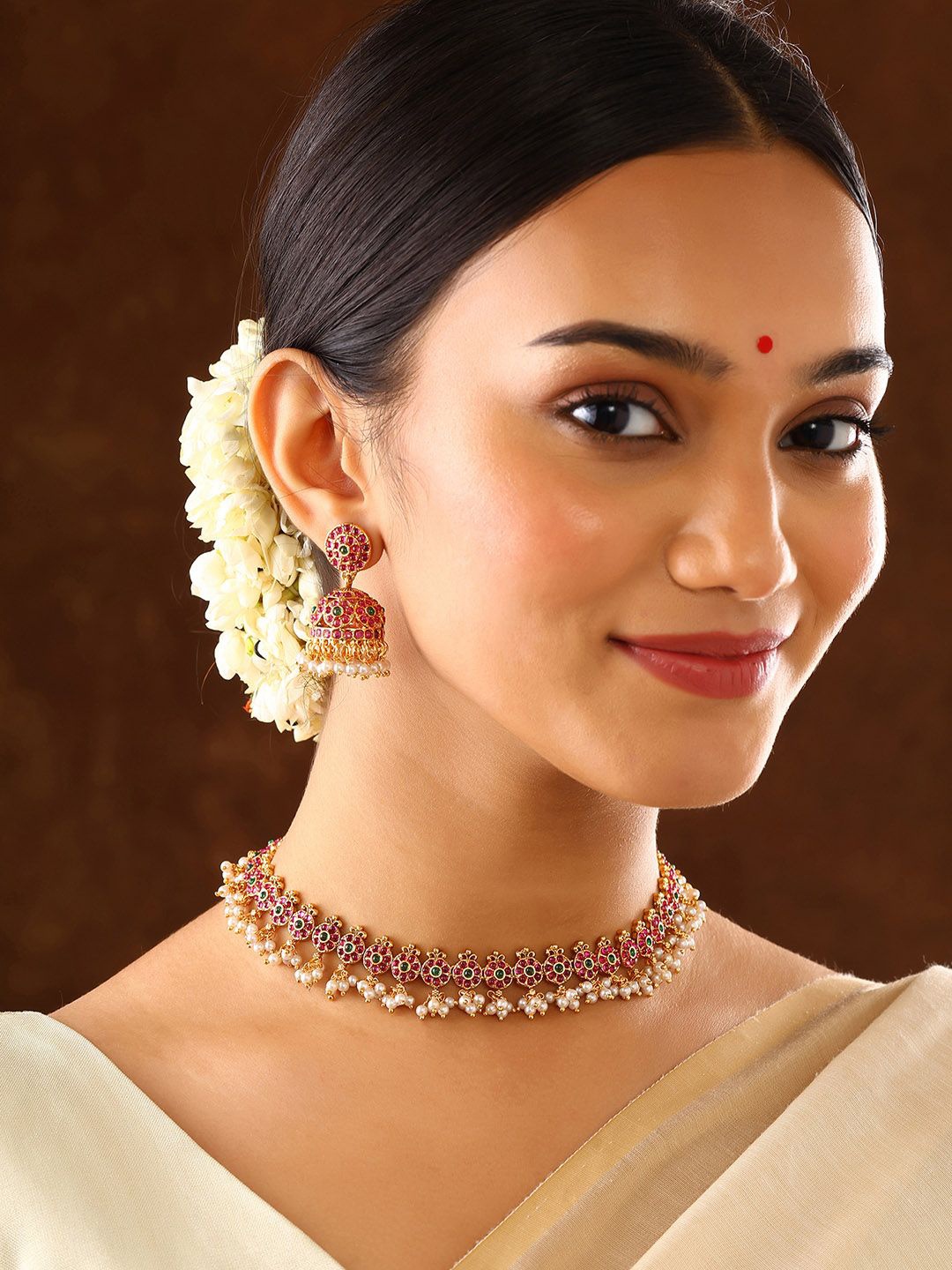 Priyaasi Gold Plated Temple Ruby Pearls & Stone Studded Floral Pattern Jewellery Set
Priyaasi Gold Plated Temple Ruby Pearls & Stone Studded Floral Pattern Jewellery Set