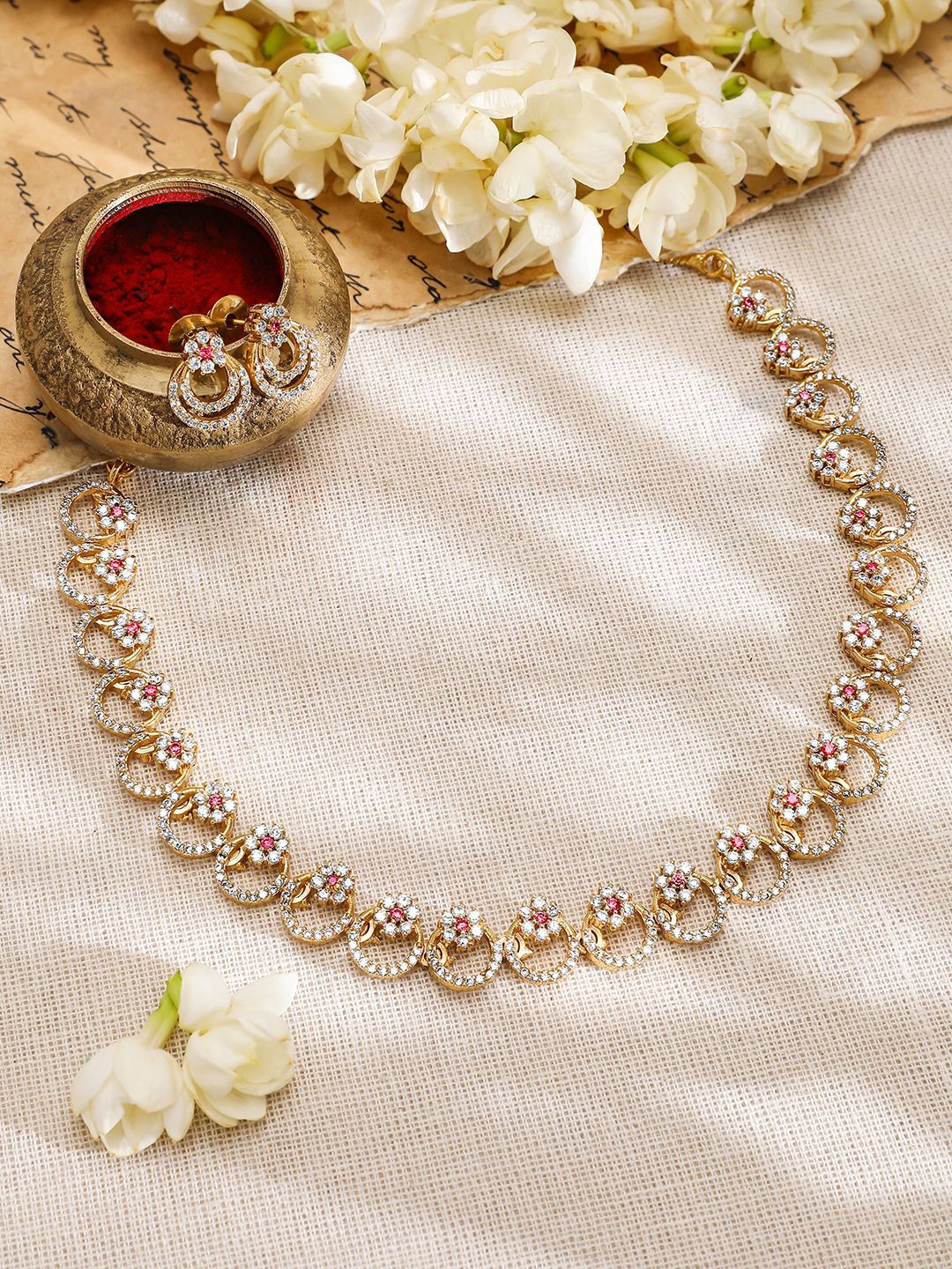 Rubans 22K Gold-Plated Cubic Zirconia & Pink Stone Studded Necklace with Matching Earrings
Rubans 22K Gold-Plated Cubic Zirconia & Pink Stone Studded Necklace with Matching Earrings