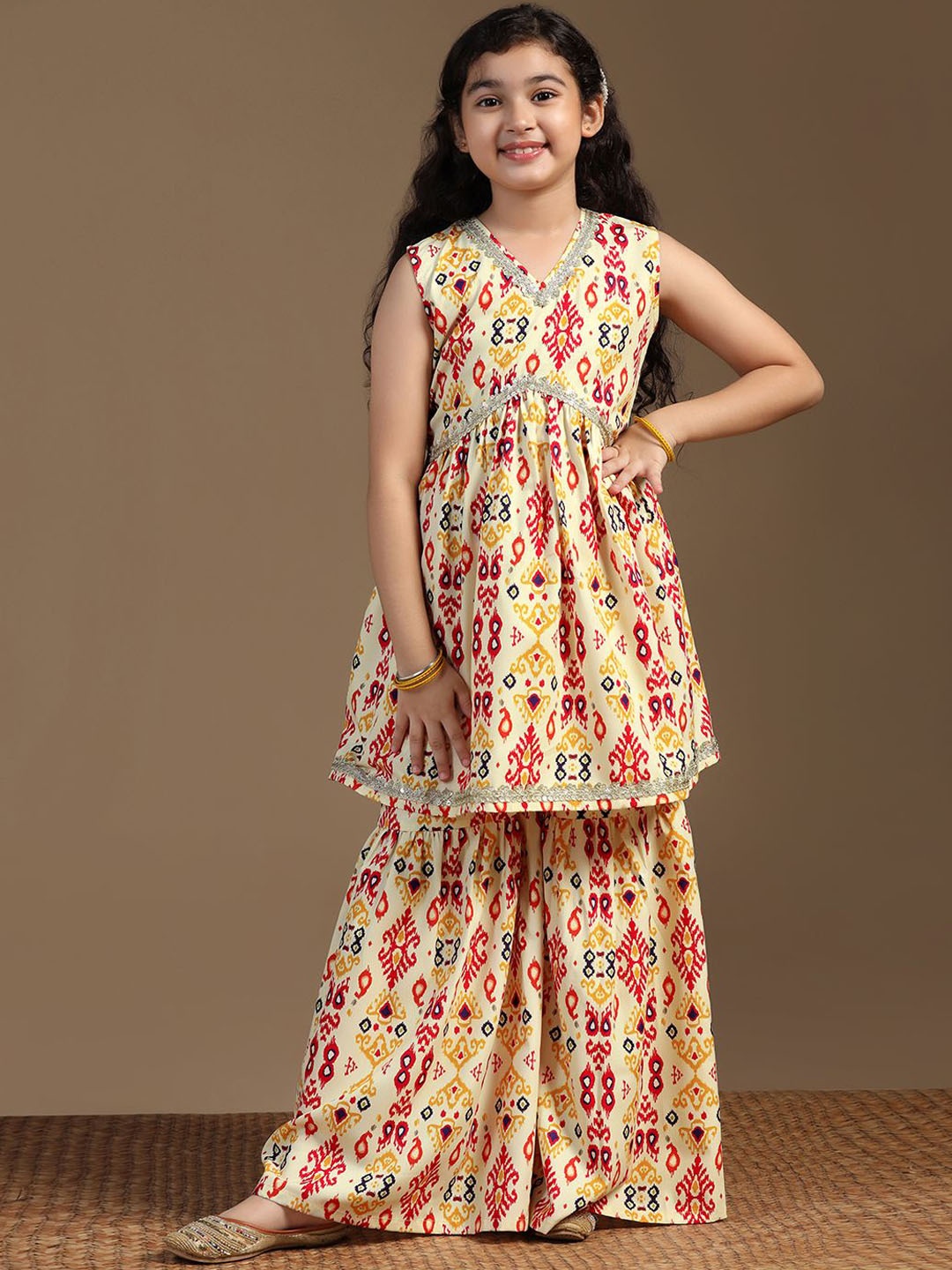 BAESD Girls Ethnic Motifs Printed Regular Sequinned A-Line Kurta with Sharara, Yellow
BAESD Girls Ethnic Motifs Printed Regular Sequinned A-Line Kurta with Sharara, Yellow