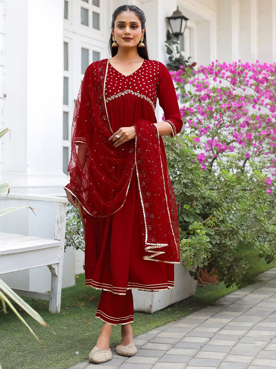 KALINI Floral Printed Empire V-Neck Anarkali Zari Kurta With Trousers & Dupatta, Maroon
KALINI Floral Printed Empire V-Neck Anarkali Zari Kurta With Trousers & Dupatta, Maroon