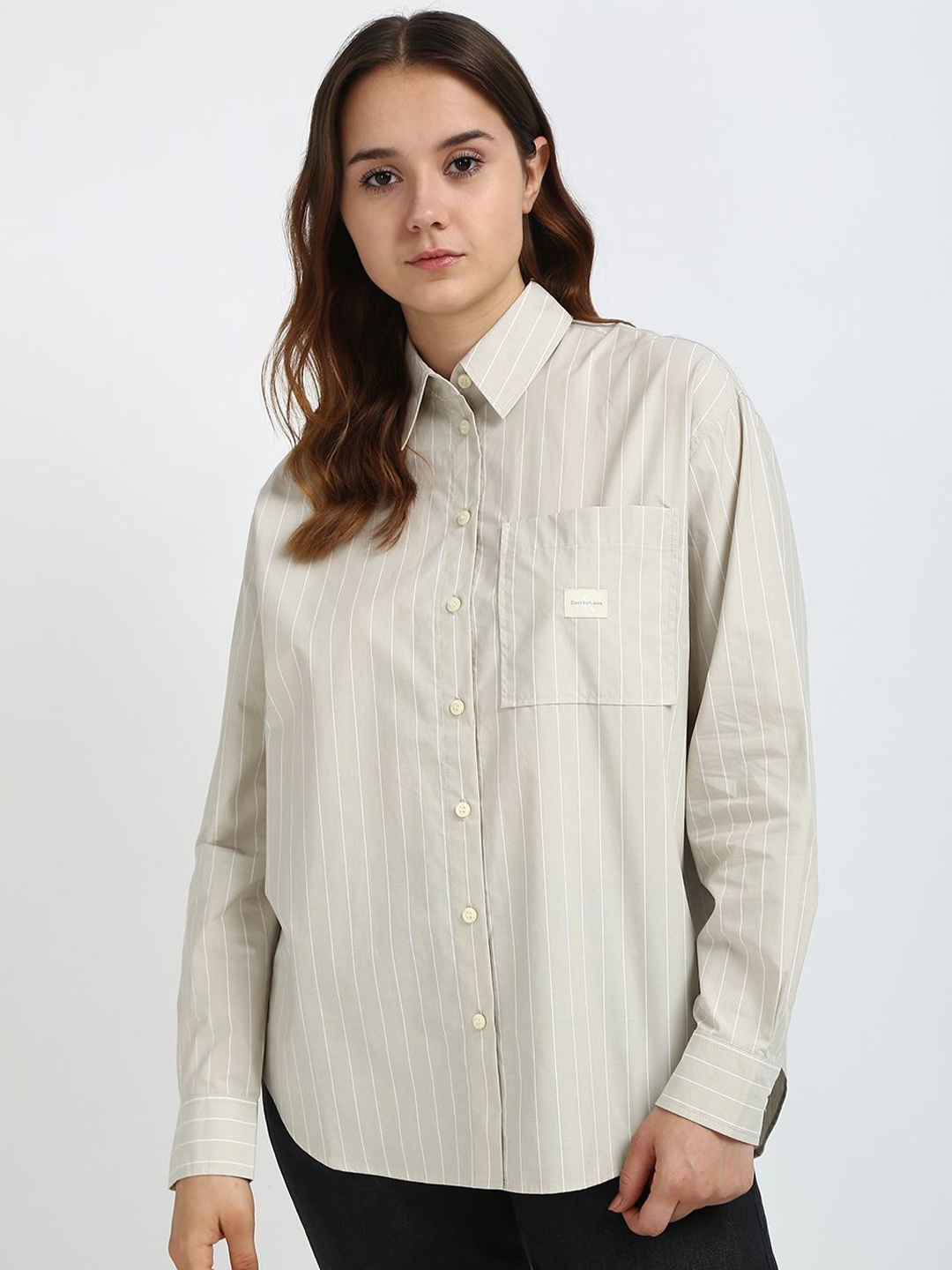 Calvin Klein Jeans Women Spread Collar Vertical Striped Cotton Relaxed Fit Casual Shirt, Grey
Calvin Klein Jeans Women Spread Collar Vertical Striped Cotton Relaxed Fit Casual Shirt, Grey
