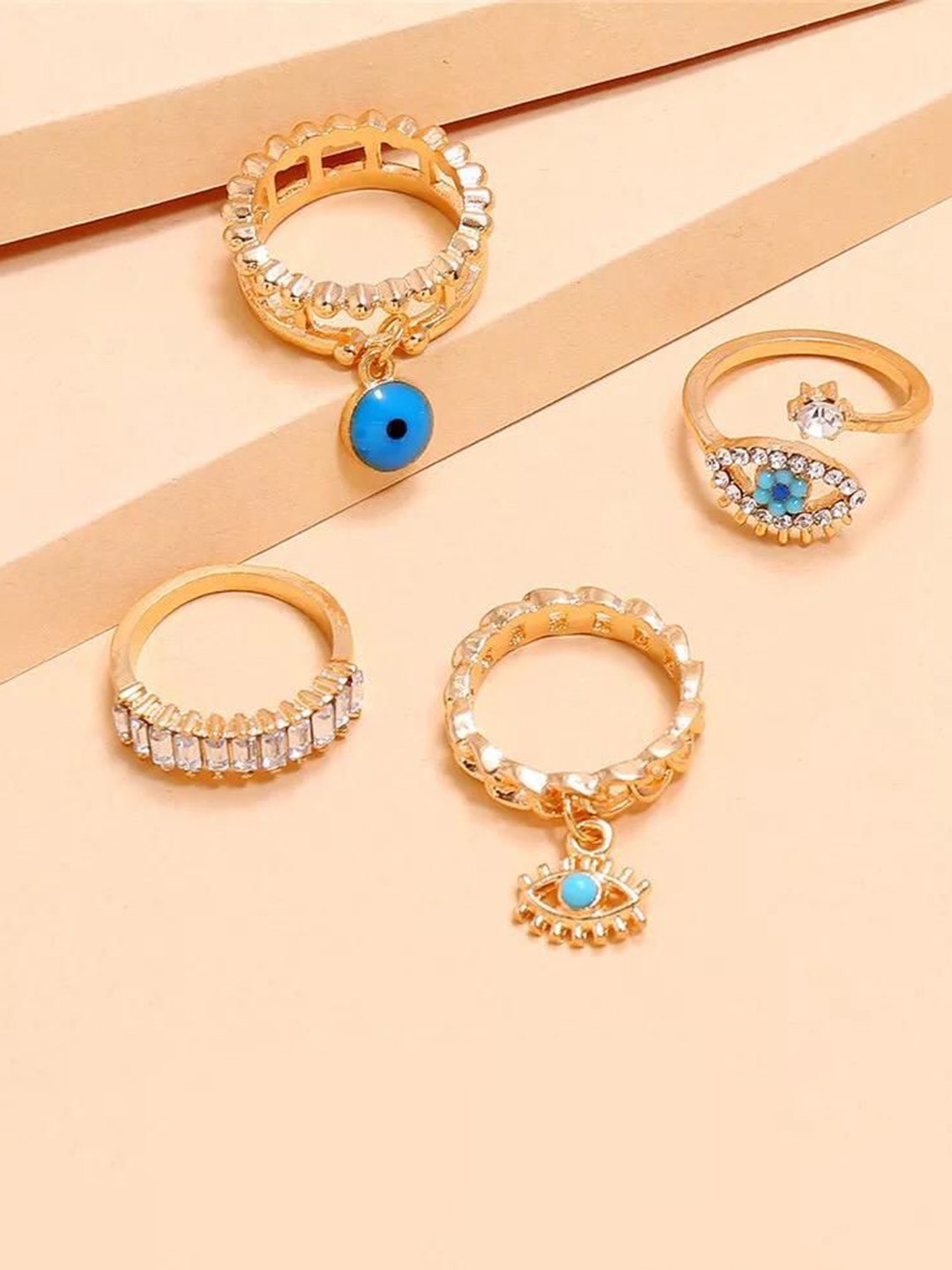 YU FASHIONS Set Of 4 Gold-Plated Rhinestone Studded Evil Demon Stainless Steel Finger Ring
YU FASHIONS Set Of 4 Gold-Plated Rhinestone Studded Evil Demon Stainless Steel Finger Ring