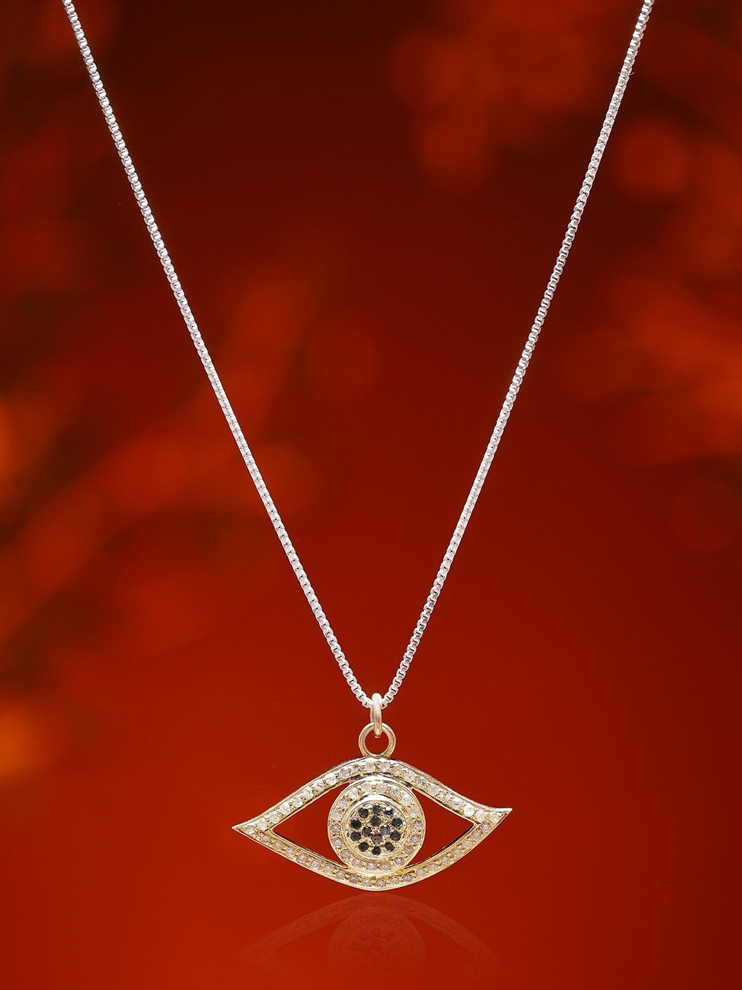 Exotic India Gold Plated Sterling Silver Evil Eye Pendant with Diamond & Emerald Gemstone
Exotic India Gold Plated Sterling Silver Evil Eye Pendant with Diamond & Emerald Gemstone