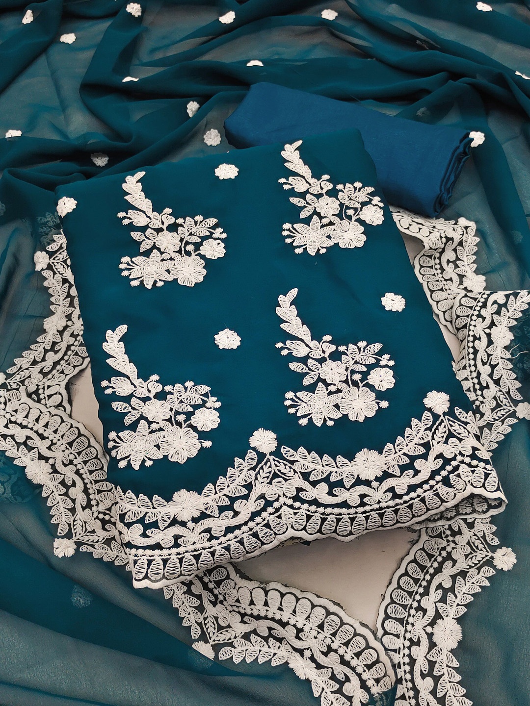 Maroosh Ethnic Motifs Embroidered Thread Work Georgette Unstitched Dress Material, Turquoise blue
Maroosh Ethnic Motifs Embroidered Thread Work Georgette Unstitched Dress Material, Turquoise blue