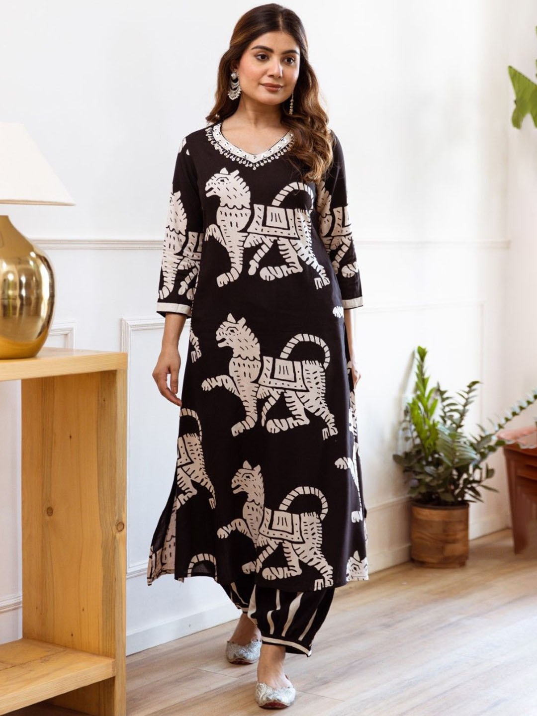 AUTUMN LANE Printed Beads and Stones Pure Cotton Straight Kurta With Salwar, Black
AUTUMN LANE Printed Beads and Stones Pure Cotton Straight Kurta With Salwar, Black