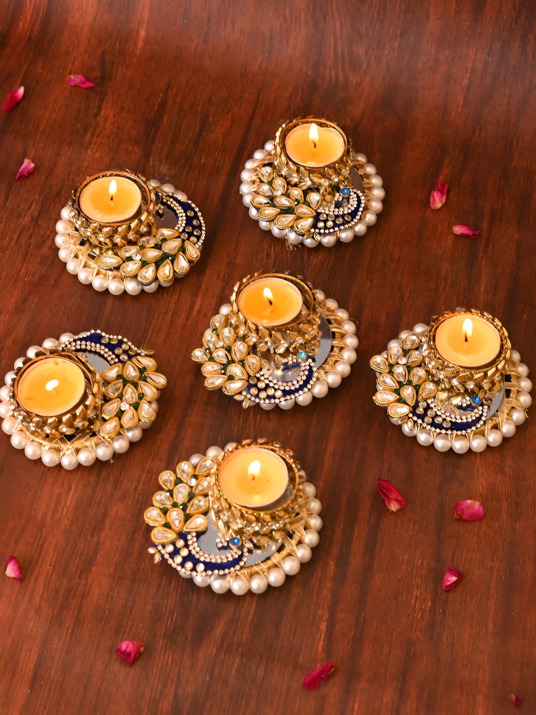 Aapno Rajasthan Gold Toned & Blue 6 Pieces Peacock Embellished Metal Tea Light Candles
Aapno Rajasthan Gold Toned & Blue 6 Pieces Peacock Embellished Metal Tea Light Candles