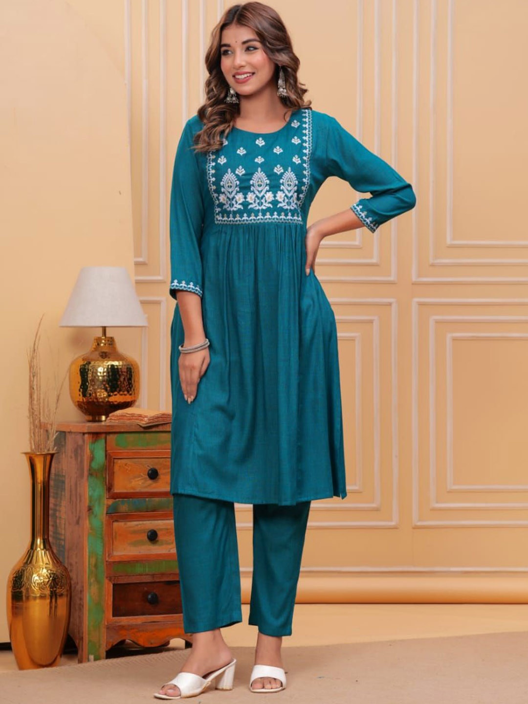 SIDDHANAM Ethnic Motifs Embroidered Empire Thread Work Anarkali Kurta with Trousers, Teal
SIDDHANAM Ethnic Motifs Embroidered Empire Thread Work Anarkali Kurta with Trousers, Teal
