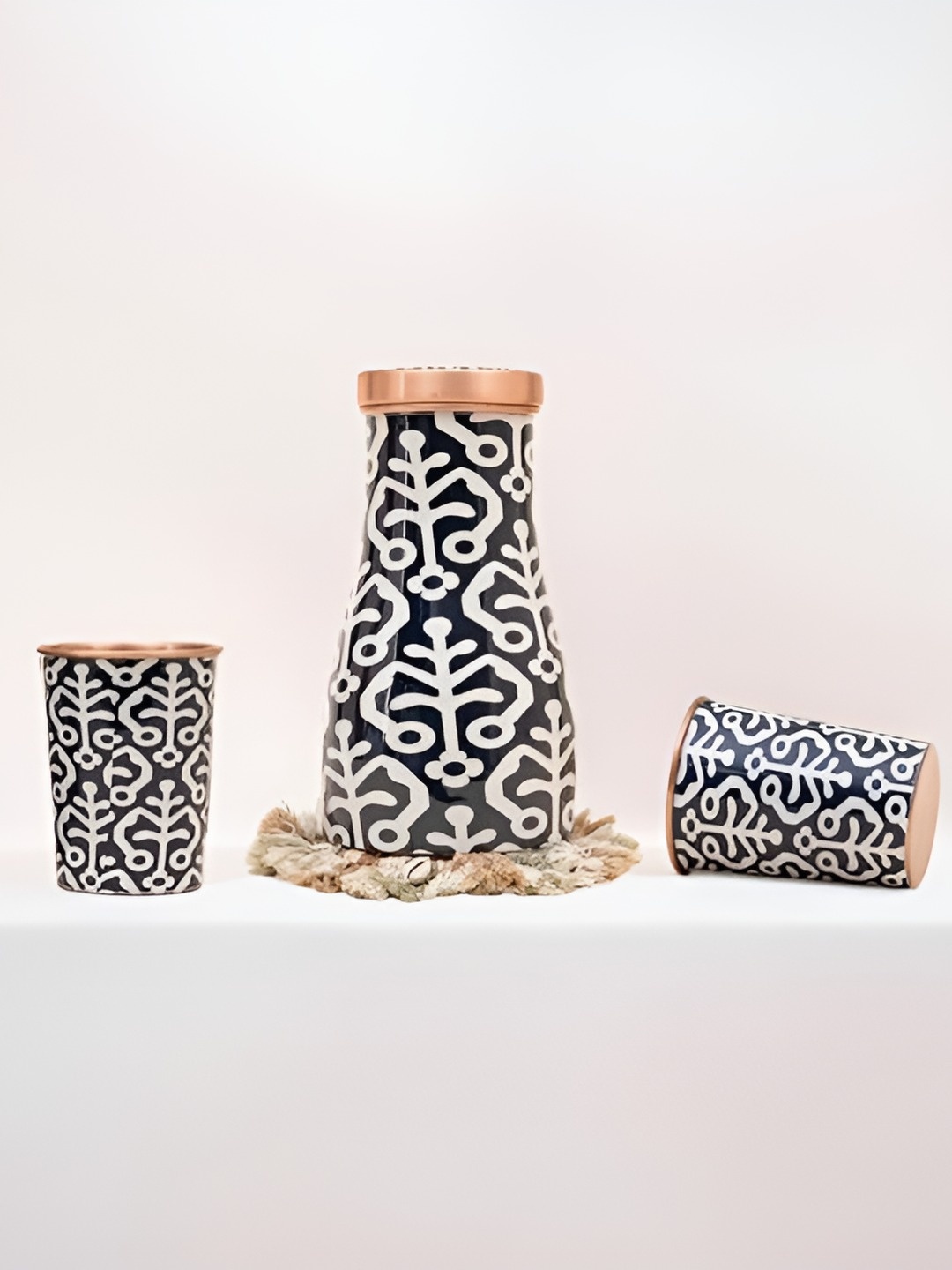veda essentials. Copper-Toned & Black 3 Pieces Copper Printed Water Bottle with 2 Glasses
veda essentials. Copper-Toned & Black 3 Pieces Copper Printed Water Bottle with 2 Glasses