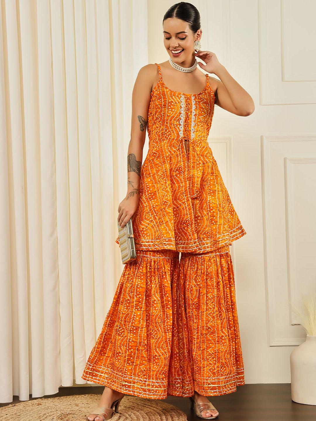 Meeranshi Bandhani Printed Shoulder Straps Pure Cotton Flared A-Line Kurta with Sharara, Yellow
Meeranshi Bandhani Printed Shoulder Straps Pure Cotton Flared A-Line Kurta with Sharara, Yellow