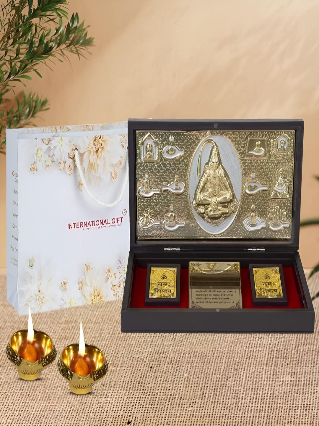INTERNATIONAL GIFT Gold-Toned Religious Lord Shiv Charan Paduka Showpiece With 2 Diya
INTERNATIONAL GIFT Gold-Toned Religious Lord Shiv Charan Paduka Showpiece With 2 Diya