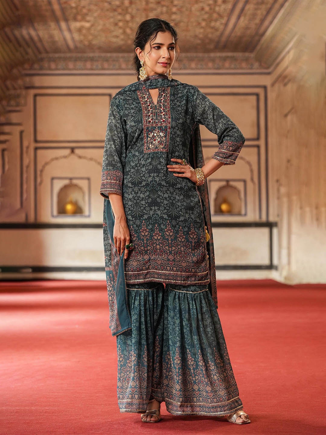 SCAKHI Floral Printed Mandarin Collar Sequinned Georgette Kurta with Sharara & Dupatta, Teal
SCAKHI Floral Printed Mandarin Collar Sequinned Georgette Kurta with Sharara & Dupatta, Teal