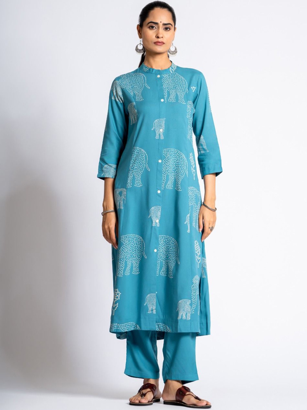 KALINI Ethnic Motifs Printed Mandarin Collar A-Line Kurta With Palazzos, Turquoise blue
KALINI Ethnic Motifs Printed Mandarin Collar A-Line Kurta With Palazzos, Turquoise blue