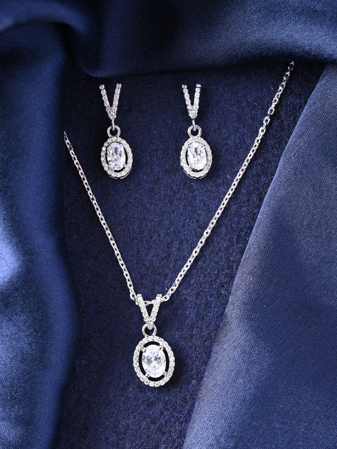 Clara 925 Sterling Silver Rhodium-Plated CZ Studded Pendant & Earrings 
Clara 925 Sterling Silver Rhodium-Plated CZ Studded Pendant & Earrings